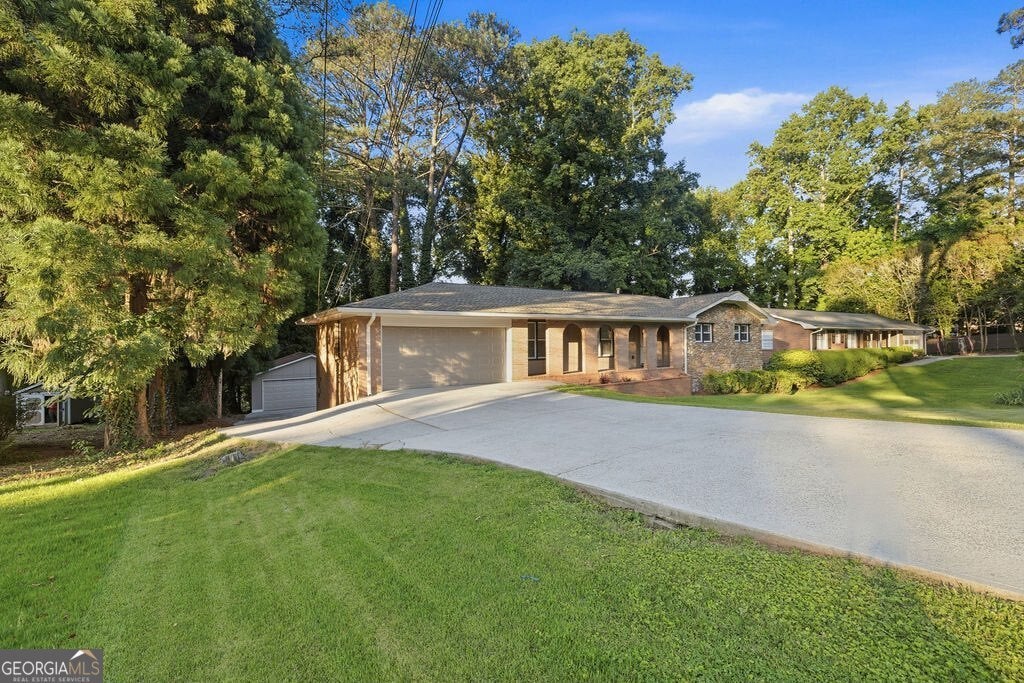 Photo of 2042 Lake Lucerne Drive SW, Lilburn, GA 30047 (MLS # 10784161)