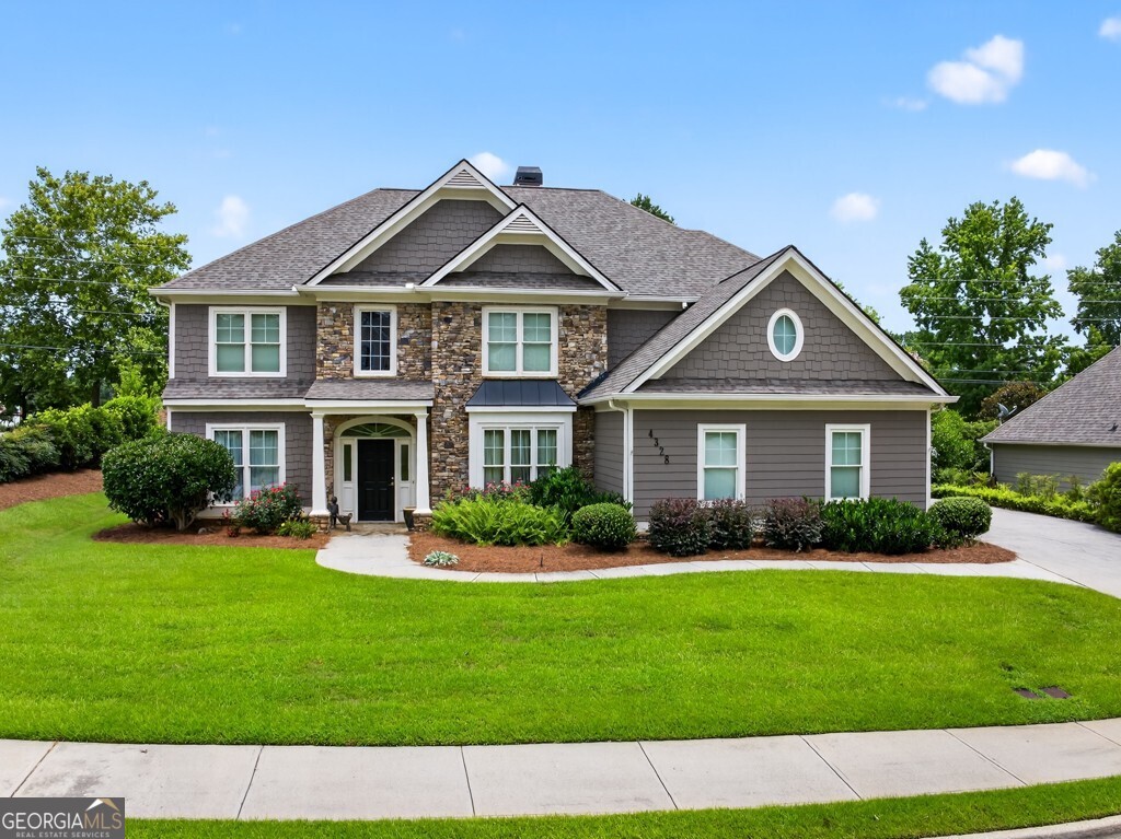 This Buford Beauty is Maintained to PERFECTION, Immaculate and MOVE-IN Ready!! Excellent Location in the Award-winning NEW Seckinger HS District! This is the Nation's FIRST AI-themed HS!! Amazing Features of this home include a Soaring 2 Story Family Room with Double Sided Wood Burning Stone Fireplace, Beautiful Updated Granite Kitchen with Hardwood Floors, Stainless Steel Appliances including Gas Range & Refrigerator, Tile Backsplash, Walk-in Pantry & View of the Fireplace!! The Warm Kitchen leads to a Bright and Airy Sunroom with newly installed Vertical Sliding Windows & Tile Flooring! Also, on the MAIN level is a convenient GUEST Bedroom and Full Bath, Formal Living Room (or OFFICE) & Banquet Size Dining Room w/Hardwood Floors! The Two Story Foyer also has Hardwood Floors and leads to an Upper-Level Spacious Owner's Suite with a Cozy Gas Fireplace! Enjoy your Gorgeous En-Suite Bath that has a Step-in Tile Shower with Rain Showerhead, Dual Vanities & Two Oversized Walk-In Closets!! Additionally, there are 3 very Spacious Secondary Bedrooms and a Full-Size Tiled Bath with Dual Vanities! Some FEATURES you'll LOVE are THREE CAR SIDE-ENTRY Garage with Painted Flooring & Utility Sink, Recently Painted Hardiplank Siding, Newer Roof (4yrs), Transferable Termite Bond, Ceiling Fans throughout, Custom Window Treatments & Security System! This Home has CURB APPEAL, situated on a Beautiful, Manicured Level Lot with a Private Backyard that includes a Firepit Patio perfect for relaxing and Entertaining! Ellsworth is a POPULAR Buford Swim/Tennis Community located just minutes from Lake Lanier and convenient to I-985 & I-85, Mall of Ga, and Top-Rated DINING and shopping! Don't miss this OPPORTUNITY to schedule your private tour TODAY to view this Buford Beauty in the Seckinger High School Cluster, known for INNOVATION and EXCELLENCE!
