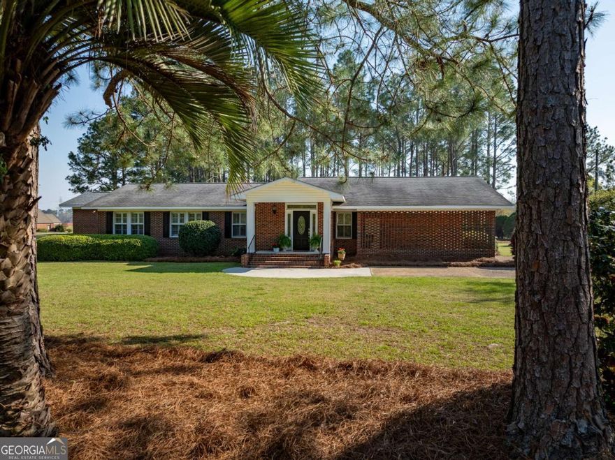 Conveniently located just minutes from downtown Tifton and with easy access to I-75, this charming brick home sits on nearly 2 acres, offering the perfect blend of privacy and accessibility. The property features a fenced backyard, a storage building with a roll-up door, and a serene area shaded by pines, complete with a gazebo-ideal for picnics or family gatherings. Inside, the home offers 3 bedrooms and 2 bathrooms with new flooring and updated kitchen countertops. The spacious family and dining room combo flows seamlessly into a large den, creating plenty of space for relaxing or entertaining. The oversized master suite includes a luxurious master bath with a Jacuzzi tub, a walk-in shower, and a generous walk-in closet. Beautiful hardwood floors run throughout the living areas and bedrooms, adding warmth and character. Additional highlights include a nearly new HVAC system, making this home move-in ready. If you're looking for a spacious home on a beautiful piece of land, this place is the perfect one for you!
