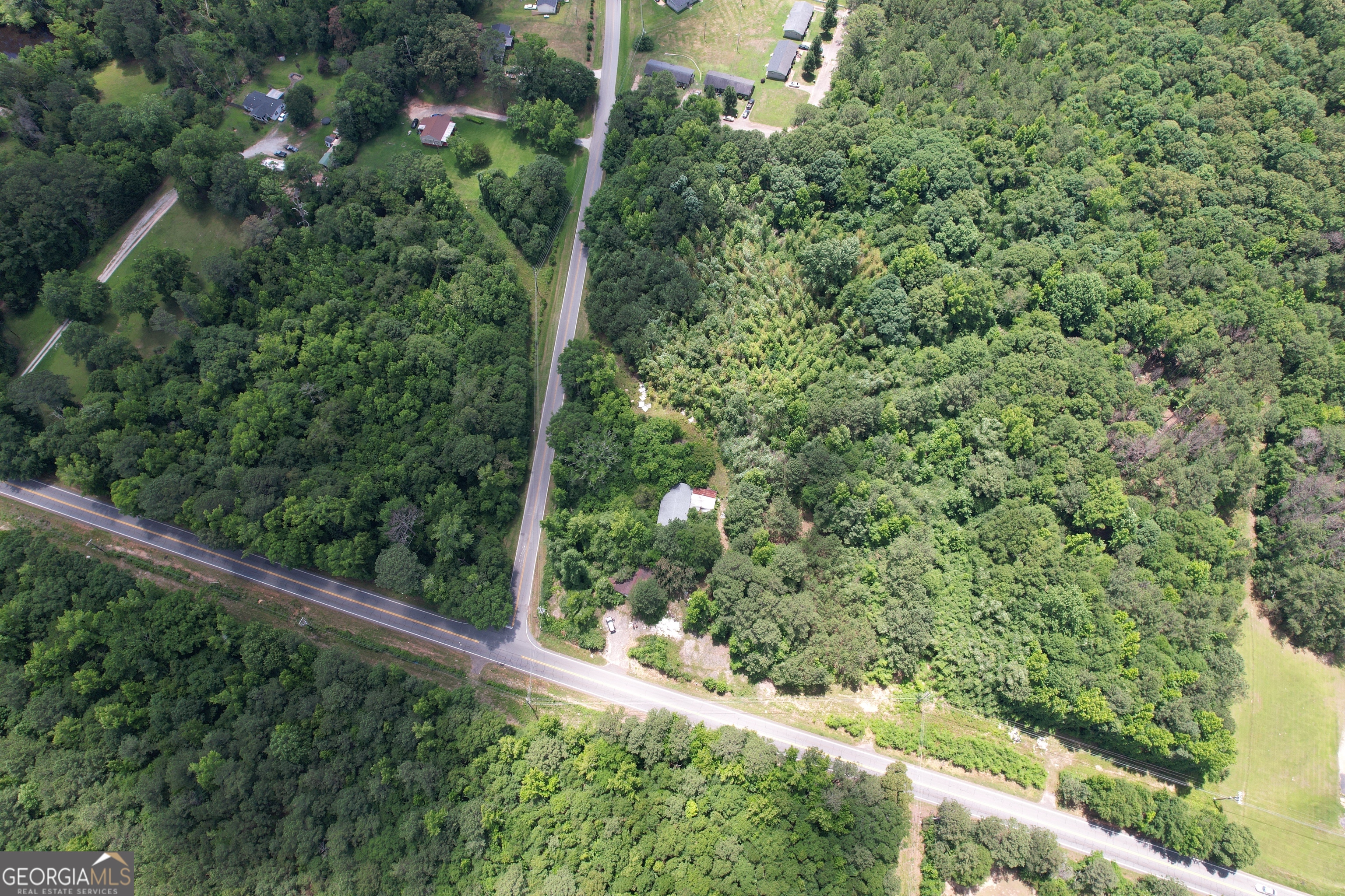 Bring your ideas to life in this amazing location! 2 parcels available : 268 02008A ( 8.83 ac.) and 268 02008B ( 4.25 ac.) can be bought together or separately. Currently zoned residential but would make the perfect commercial lots with double road frontage and on Hwy 16/ Newnan Rd. & Maloy Rd.