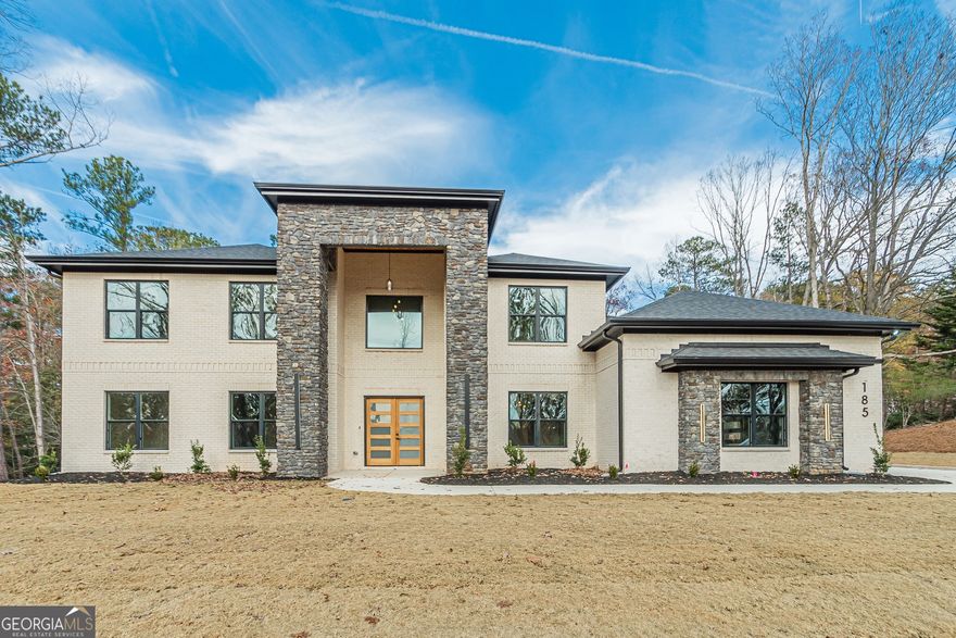 Discover your dream home in desirable McDonough, GA, at 1330 Upchurch Road. This custom-built new construction home by Splendid Development, a high-end luxury custom builder known for superior craftsmanship, is a design-forward masterpiece with a timeless open floor plan. The home's dramatic flair begins with a grand entrance foyer and it is complemented by high-end finishes, including a detailed trim package, built-ins, and soaring ceilings throughout.The main level features a great room with a fireplace that opens to an expansive outdoor living area, perfect for entertaining. The stunning chef's kitchen is a culinary masterpiece showcasing quartz countertops, a dramatic waterfall island, high end stainless steel appliances, custom cabinetry, and a spacious walk-in pantry.   The first of the two luxurious owner's suites on the main level boasts a spa-inspired bath featuring a soaking tub flanked by dual quartz vanities, an oversized tile shower, and a massive walk-in closet. The second floor offers a spacious layout with a second owner's suite, four additional bedrooms, each with en suite bathroom and walk in closets. The second-level family room opens up to a beautiful covered upper porch, perfect for enjoying the outdoors from the second floor. The home also includes a three-car garage. This home is a must-see for anyone looking for the ultimate luxury living experience. With its prime location, superior craftsmanship, and stunning features, this home will not be on the market for long.  Please note: Pictures and the virtual tour are from a previous build and do not represent the exact floor plan. *The Home is under construction, Completion date Late February 2026 *