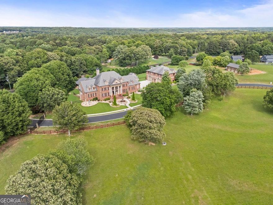 An exceptional development opportunity awaits in the heart of Hoschton, one of North Georgia's fastest-growing communities. This expansive property was originally envisioned in 2007 as Ambrosia Villas, a 14-home enclave designed to blend luxury living with a peaceful, private setting. Though the original project was never completed, the groundwork has been laid-literally-for future success. Set on a beautifully graded landscape, the larger parcel already features underground utilities, making it ideal for a seamless transition into new construction. Whether you're a custom builder or a developer focused on spec homes, this is a rare chance to capitalize on a turnkey opportunity with infrastructure in place. Hoschton has become a magnet for residential growth, thanks in part to the overwhelming success of nearby Ch teau  lan, a resort-style community that helped redefine the area as a premier destination for upscale living. With easy access to I-85, top-rated schools, retail, dining, and medical facilities, this location offers a perfect blend of convenience and charm for prospective homeowners. Zoned for residential development and already graded, this land offers a picturesque canvas for creating a cohesive, luxury community. Mature trees line the perimeter, offering natural privacy, while open, level terrain provides flexibility in site planning and home placement. The original Ambrosia Villas concept can be revisited or reimagined with today's market needs in mind-whether that means spacious custom estates, stylish semi-custom builds, or thoughtfully designed spec homes. The property's layout and improvements make it well suited for gated access, community greenspaces, or added amenities that enhance long-term value and market appeal. With demand for new construction continuing to rise across the metro Atlanta area, this site offers a unique mix of past planning, present potential, and future promise. Don't miss this incredible chance to bring a visionary development to life in one of the region's most exciting growth corridors. Ambrosia Villas may have begun as an idea in 2007-but today, it's a builder's dream ready to become reality.