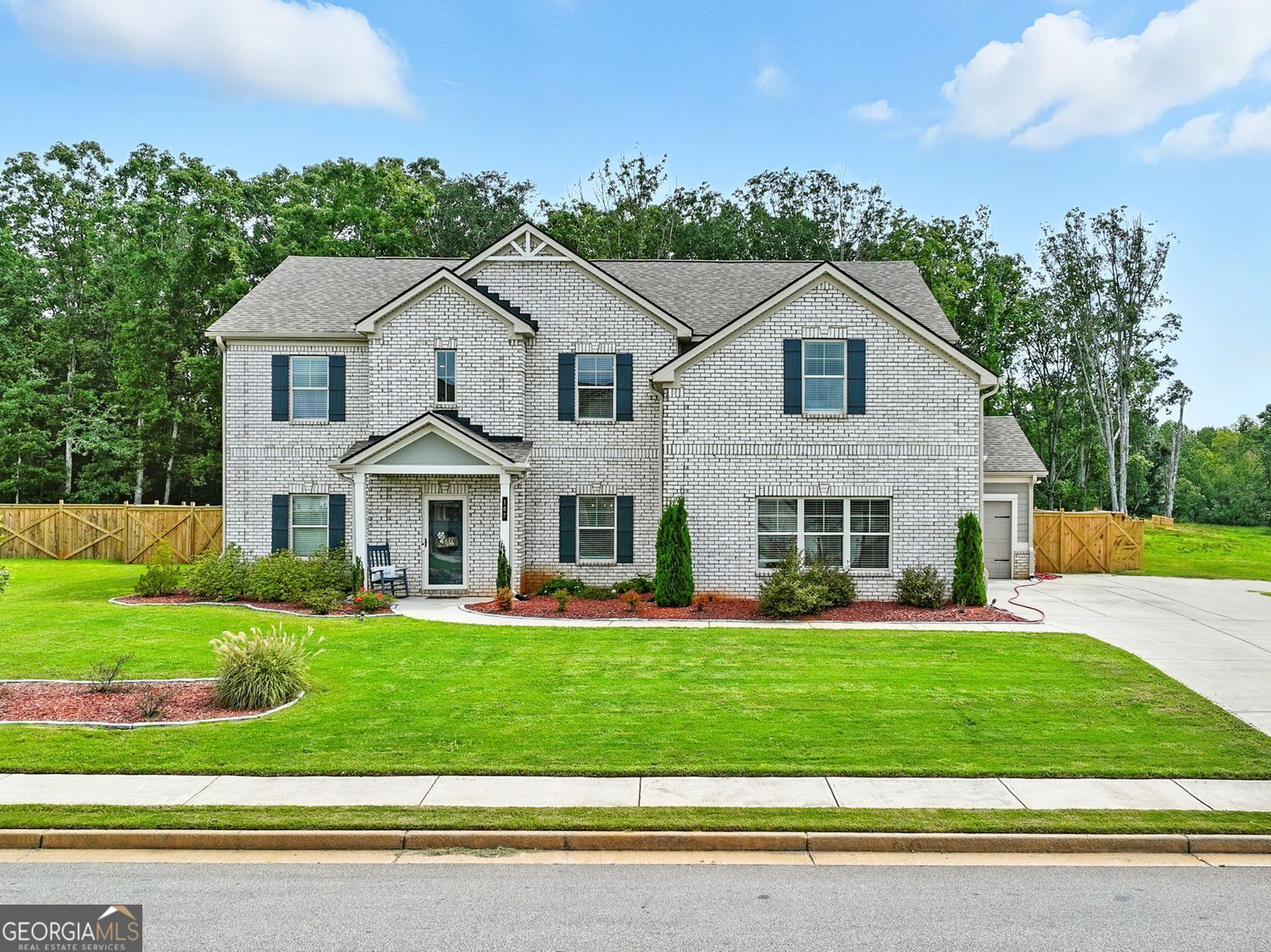 Welcome to refined Southern living in this beautifully built 3-year-old brick home, perfectly situated in a secure, gated community. Boasting 5 spacious bedrooms and 4 full bathrooms-including two lavish owner's suites-this home offers comfort, style, and flexibility for modern living. The versatile bonus room can easily serve as a 6th bedroom, home office, gym, playroom, or guest retreat-tailored to your lifestyle. Step into the gourmet kitchen featuring granite countertops, stainless steel appliances, a walk-in pantry, and designer cabinetry-all flowing into an open-concept living space designed for entertaining. Outside, enjoy the upscale ambiance created by recessed lighting around the entire exterior, enhancing curb appeal and evening elegance. The private backyard is a true retreat with a custom fire pit, charming gazebo, and plenty of space to unwind or entertain. A 3-car garage offers generous storage and parking. This home delivers luxury, practicality, and presence-all in one of the area's most desirable neighborhoods. Schedule your private tour today!