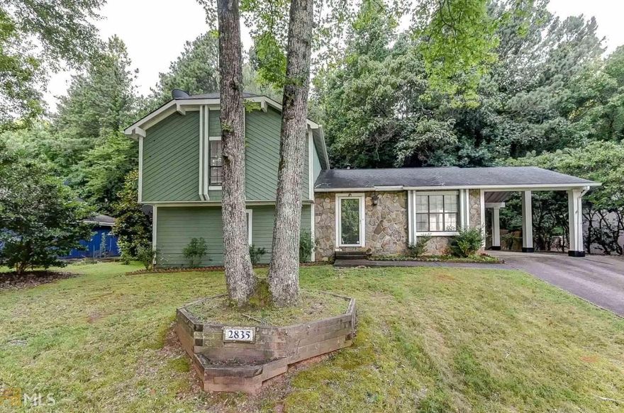 Welcoming split level on almost 1/2 acre features stone front and large driveway. Full finished bottom level w/gas fireplace, bath & access to screened-in porch! Slate foyer entry,  kitchen w/breakfast bar & spacious master. Leveled, fenced private and wooded lot (xtends past fence!) Fabulous location close to great schools, restaurants & shopping! Perfect home for small families, investment opportunities, short term or long term rentals.