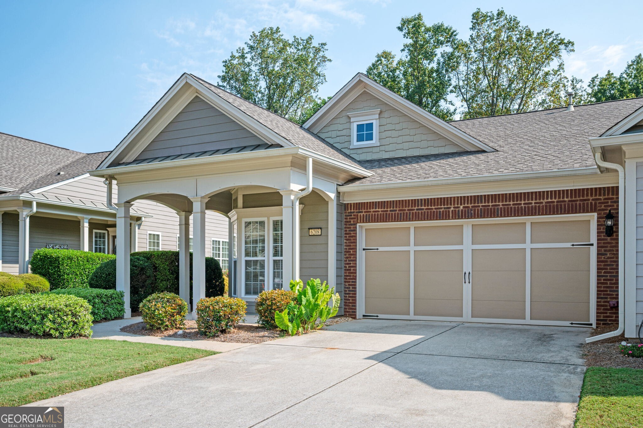 Welcome to 6208 Longleaf Drive in the highly desirable Village at Deaton Creek, an active 55+ community offering resort-style amenities and a neighborly lifestyle. This Kenwood floor plan villa features 2 bedrooms, 2 full baths, an eat-in kitchen, and a spacious living room that opens to a private patio and large, grassy backyard. The home has been beautifully updated with wood floors throughout, fresh paint in key rooms, a new ceiling fan, custom sunshade at the entry, and new curtain rods and curtains. Additional improvements include a replumbed main water line with pressure gauge, upgraded garage door motor, spring, and rollers, Nest programmable thermostat, HVAC with UV and HEPA filters serviced twice yearly, new range/oven with built-in air fryer, and freshly painted kitchen and backsplash. The lanai, hallways, master bedroom, and bath have also been repainted. A Lavender Pest Control contract provides semi-annual interior, exterior, and attic treatments. Outside, the patio has been pressure washed, downspout filters added, outdoor spigots fitted with temperature-control covers, and ATT fiber wiring installed for high-speed internet. The HOA covers roof, exterior paint, gutters, and lawn care, making this the perfect low-maintenance lifestyle. Village at Deaton Creek offers an abundance of amenities, including indoor and outdoor pools, a fitness center, dance and exercise classes, clubs, and over 8 miles of walking trails. Added Peace of Mind: Seller has already paid in full the community-wide neighborhood improvements assessment.
