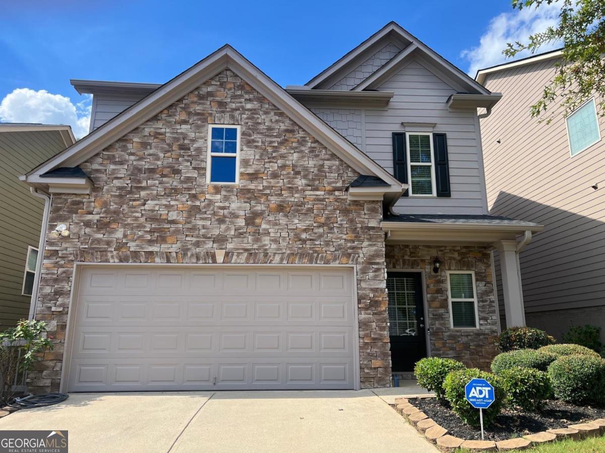 Seize the opportunity to own this exquisitely upgraded 3-bedroom, 2.5-bath home in the heart of Buford near Lake Lanier, where modern luxury meets low-maintenance living. Priced to sell in today's market, this move-in-ready masterpiece boasts high-end finishes and major system updates, making it a standout choice for families, professionals, or investors seeking unmatched value in Gwinnett County's thriving community and the the highly rated Seckinger High School district. Step inside to discover gleaming wood floors that flow through an open-concept layout, freshly painted inside and out (2025) for a crisp, contemporary feel. The gourmet kitchen shines with stainless steel appliances and a spacious island, perfect for hosting friends or family dinners. The master suite is a serene retreat, featuring a spa-inspired bath with dual vanities, while two additional bedrooms and a full laundry room offer flexibility for a home office, gym, or guest space. Outside, the custom stone veneer facade elevates curb appeal, setting this home apart from the rest. The cozy, easy maintenance backyard is a private haven-thoughtfully designed effortless entertaining or quiet evenings. The level lot is perfect for pets or play, offering just the right amount of space with minimal upkeep. Major upgrades ensure peace of mind: a brand-new roof (2025), new water heater (2025), and fresh exterior paint enhance durability and efficiency, saving you thousands in future costs. Located minutes from top-rated Gwinnett County schools, Lake Lanier's recreational paradise, and the bustling Mall of Georgia, this home blends suburban tranquility with easy I-85 access to Atlanta. $10,000 Down payment assistance available to FHA eligible borrowers! 1% Down payment assistance available for conventional eligible borrowers! Appraisal credit available! Please contact the preferred lender Gabriela Villafranco at 678-458-3807 for more details. Seller is open to buyer closing costs, rate buy downs or other incentives with a strong offer.