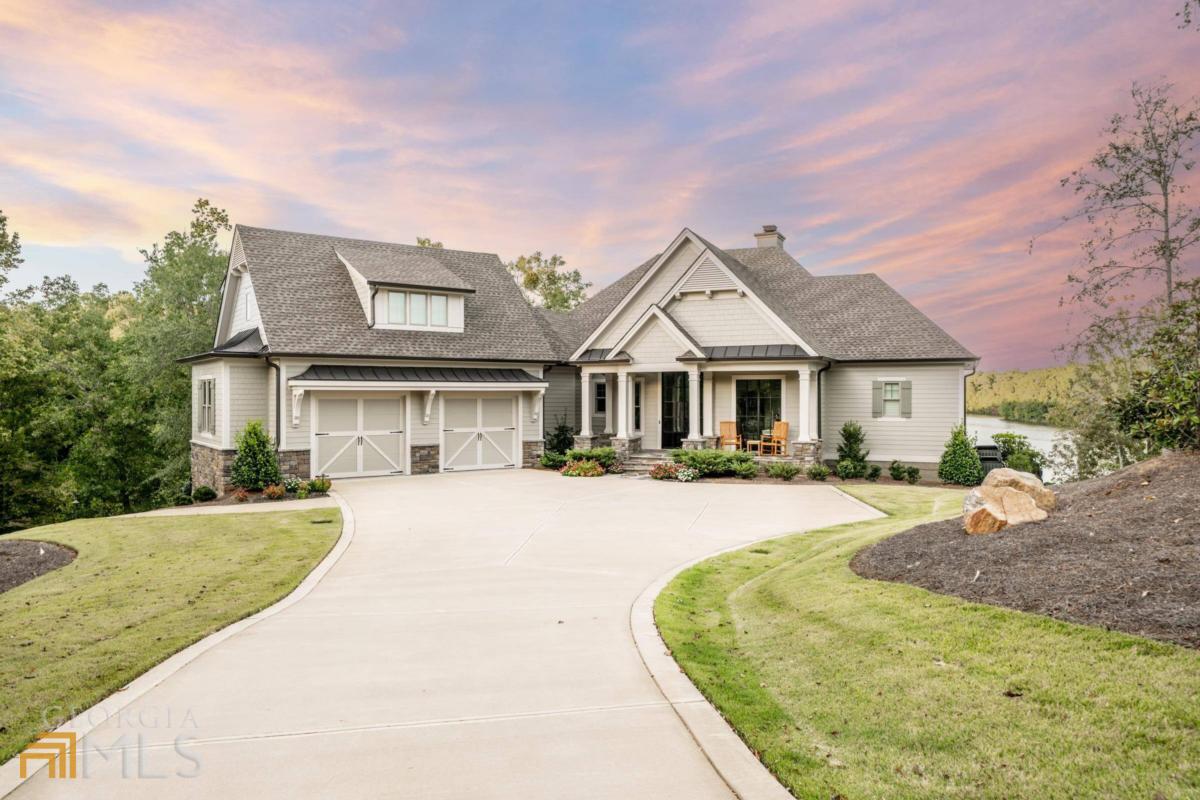 DON'T MISS THIS BEAUTIFUL CUSTOM BUILT WATERFRONT HOME IN MONTGOMERY PLACE AT REYNOLDS LAKE OCONEE. SITUATED ON A WONDERFULLY PRIVATE LOT WITH REMARKABLE BIG WATER VIEWS TO LAKE OCONEE, THIS RECENTLY BUILT 5 BEDROOM / 5 FULL AND 1 HALF BATH HOME WAS DESIGNED SO ALMOST EVERY BEDROOM AND ALL OF THE GREAT INDOOR & OUTDOOR SOCIAL AREAS ARE ABLE TO ENJOY THE AMAZING WATER VIEWS. FROM THE MOMENT YOU WALK THROUGH THE FRONT DOOR YOU ARE EYES ARE DRAWN TO LAKE AND AS YOU MOVE THROUGH THE GREAT OPEN FLOOR PLAN THOSE AMAZING VIEWS TO LAKE OCONEE SEEM TO FOLLOW YOU EVERYWHERE. BUILT BY RICK BUECHLER CUSTOM HOMES, YOU WILL SEE QUALITY FINISHES AROUND EVERY CORNER AND AND INCREDIBLE ATTENTION TO DETAIL THROUGHOUT. AS ONE OF THE FEW MOVE IN READY LAKE HOMES CURRENTLY AVAILABLE IN REYNOLDS LAKE OCONEE, THIS GREAT HOME WILL GET A LOT OF ATTENTION. SELLER IS MAKING A CLUB MEMBERSHIP AVAILABLE.