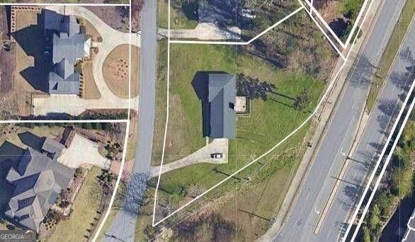 BUILDER ALERT! Large residential lot with panoramic city views in upscale residential area with beautiful million dollar plus homes. The value of the property is in the land, but the home is in great shape with many updates sitting on a lot that is level across the front, gently sloping to the back. With the classic ranch 3 bed, 2 bath main level, this home also features a basement with a bedroom and bath as well as a garage. The lot is currently zoned R30 but is surrounded by much more dense housing so partitioning to 2 lots at R20 should be easily doable. A package with an older survey, sewer & water map, recent area activity and more is available on request. Please schedule an appointment before accessing/walking the property to respect the privacy of the sellers - however, it is fairly easy to get a general idea of the lot's topo layout from a drive-by as it is viewable on 3 sides.