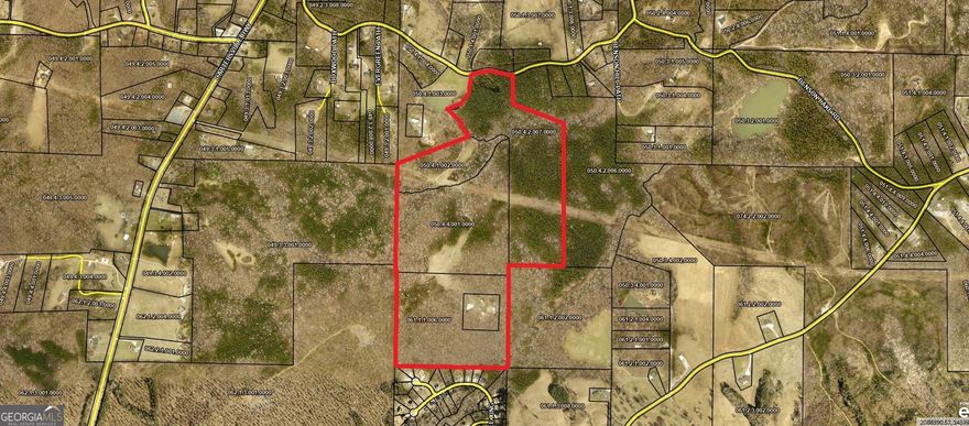 The most amazing land parcel in North Paulding has just become available. This assemblage of family land creates approximately 141 acres of prime real estate within the North Paulding High School District - perfect for residential development. If that wasn't enough - the family spent decades building a world class wedding/event venue "town". Situated among 5 acres, deep within the property sits the "town" of YNOT. The town consists of a modern event/reception venue, guest cabin, primitive church, saloon (which serves as a dual dressing area for wedding parties), an additional restroom building among other town built-in elements. It is easy to picture yourself located in the middle of a Hollywood movie set. The town has power, internet, and is serviced with water by an artisan well (85 gal/min). The event/reception building is approximately 3,400 sq.ft with a great room, his & her restrooms, a serving room, and a warming kitchen. "3" 5 Ton heat pump air units serve the facility. The parcel has approximately 500 ft. of frontage on Benson Rd. The land has a mix of wooded areas, cleared level areas and gently rolling areas that contribute to the overall beauty of the property. Pictures really do not do this property justice. The property is shown by appointment only.