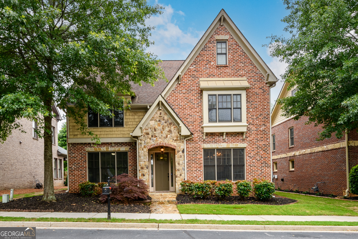 BEAUTIFUL 4-sided brick home on level lot. PRIME LOCATION! AWARD WINNING SCHOOLS!! New hardwood floors throughout. Modern kitchen with lots of cabinet space, new upgraded Kitchen-aid appliances, under counter lighting, butler's pantry, separate breakfast area, pantry and open to the family room. Family Room filled with tons of natural light all day long. Family room boast built-ins and gas logs in fireplace. Upstairs features an enormous Master Suite w/ trey ceiling and master bath with double vanity and a huge walk-in closet that is hard to find in many homes these days. 2 spacious secondary Bedrooms with good size closet on the second level perfectly serves the needs of families with children. Laundry room is conveniently located upstairs for easy access to all bedrooms. An ADDED BONUS "THIRD FLOOR" with attached full bathroom is a unique feature to this house that provides perfect space for a Teen suite/Hobby/Media room or just use it as yet another bedroom. Additional storage and separate HVAC make it even more desirable. Last but not the least the cozy covered patio will be lovely to enjoy your morning coffee or evening wine. This Home is in a very family friendly neighborhood with lots of children around. It is move-in ready house with easy access to GA 400 and just minutes away from Halcyon's premier shopping, Big Creek Greenway Trail, Emory and Northside Hospital, Schools, Parks, Restaurants, Library and many more. A Must-See Beauty... Won't Last Long...So Hurry !!