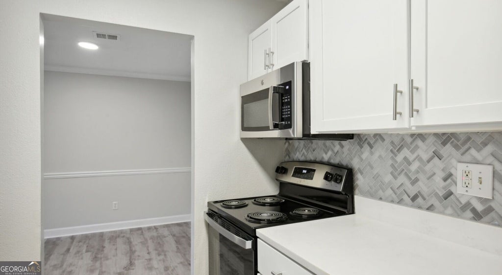 Photo of 100 Pinhurst Drive #1131L, Atlanta, GA 30339 (MLS # 10842093)