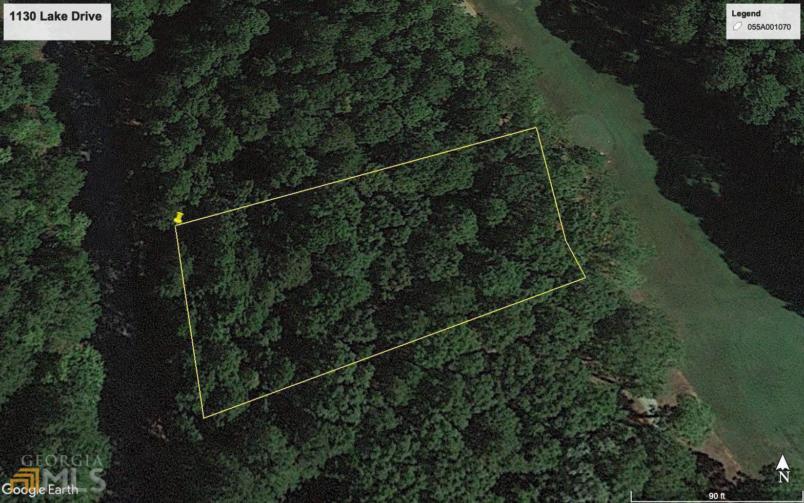 This gorgeous mostly level 0.68 acre golf front lot sits just off the 13th fairway in the Harbor Club community. The wooded lot has wonderful views of Harbor Club's Morrish-Weiskopf course, which Golf Week ranked in the top four you can play in the state of Georgia. Coupled with neighborhood access to the lake and boat storage through the Boathouse Marina at Harbor Club, you can buy and build to enjoy all this lake and golf community has to offer. With a neighborhood pool, tennis courts, pickleball courts, fitness center, and so much more, Harbor Club is the perfect place to build your home. Qualifies for membership incentive of $5k toward closing costs and 12 months of waived dues.