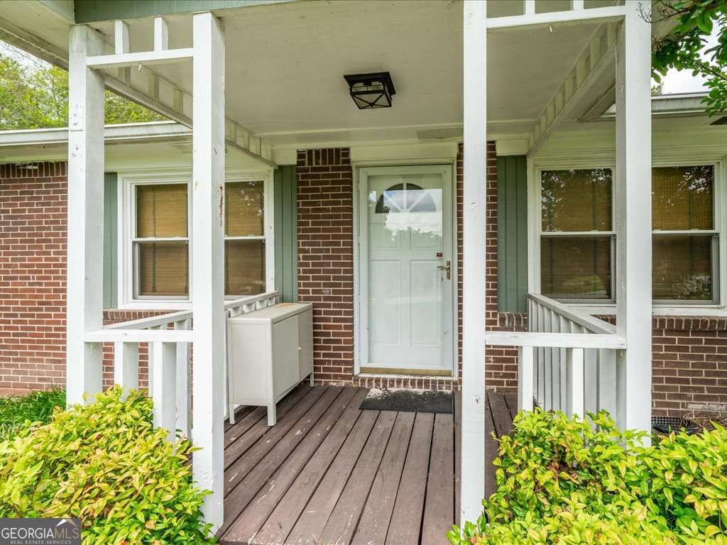 Welcome to a neighborhood so loved, many of the original owners never left-now it's your chance to join them! This charming all-brick ranch has everything you've been looking for. Nestled on nearly half an acre, the level, fenced yard is perfect for relaxing mornings on the front porch or hosting backyard barbecues on the patio. Inside, you'll find an oversized living room and beautiful hardwood floors. The renovated kitchen (2019) shines with granite countertops, stainless steel appliances, and rich cherry wood cabinets. Two spacious secondary bedrooms share a hall bath with charming beadboard detail. The primary suite includes a rare bonus for the neighborhood: a private half bath and walk-in closet! A sunny bonus room offers flexible space and convenient access to laundry with washer and dryer included. Need extra storage? There's a dedicated shed in the backyard for all your tools and toys. Don't miss this quintessential 1960s brick ranch-it's full of character, function, and pride of ownership!