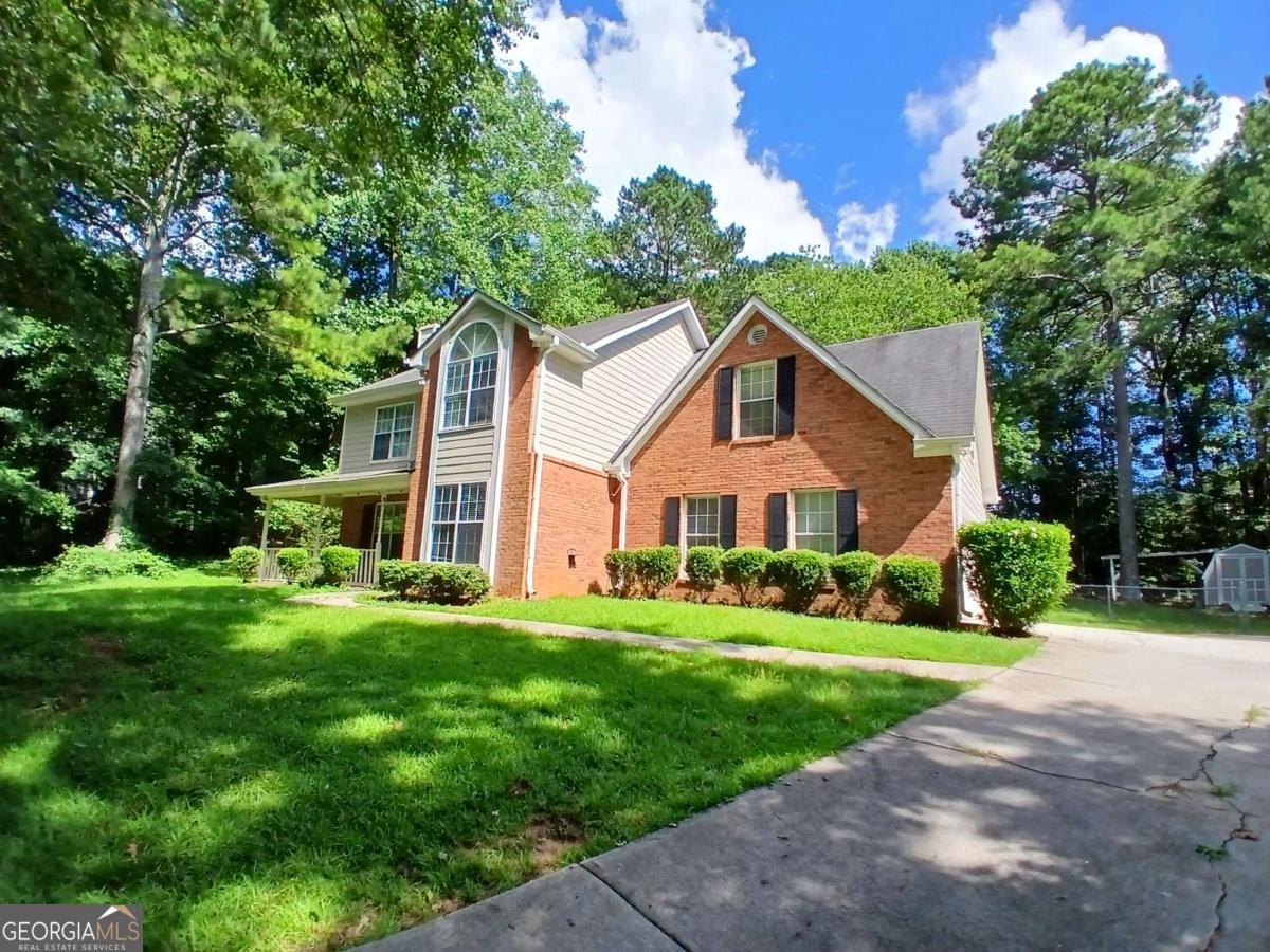 Completely refreshed! Must see. New Floors, New paint, New cabinets. Large lot (1 Acre) in quiet cul-de-sac. Front porch and private back yard. Wood burning Fireplace, eat-in Kitchen, and large master with trey ceiling and walk-in closet. Master bath has jetted tub and separate shower. Storage closet in two car garage plus shed in back yard.