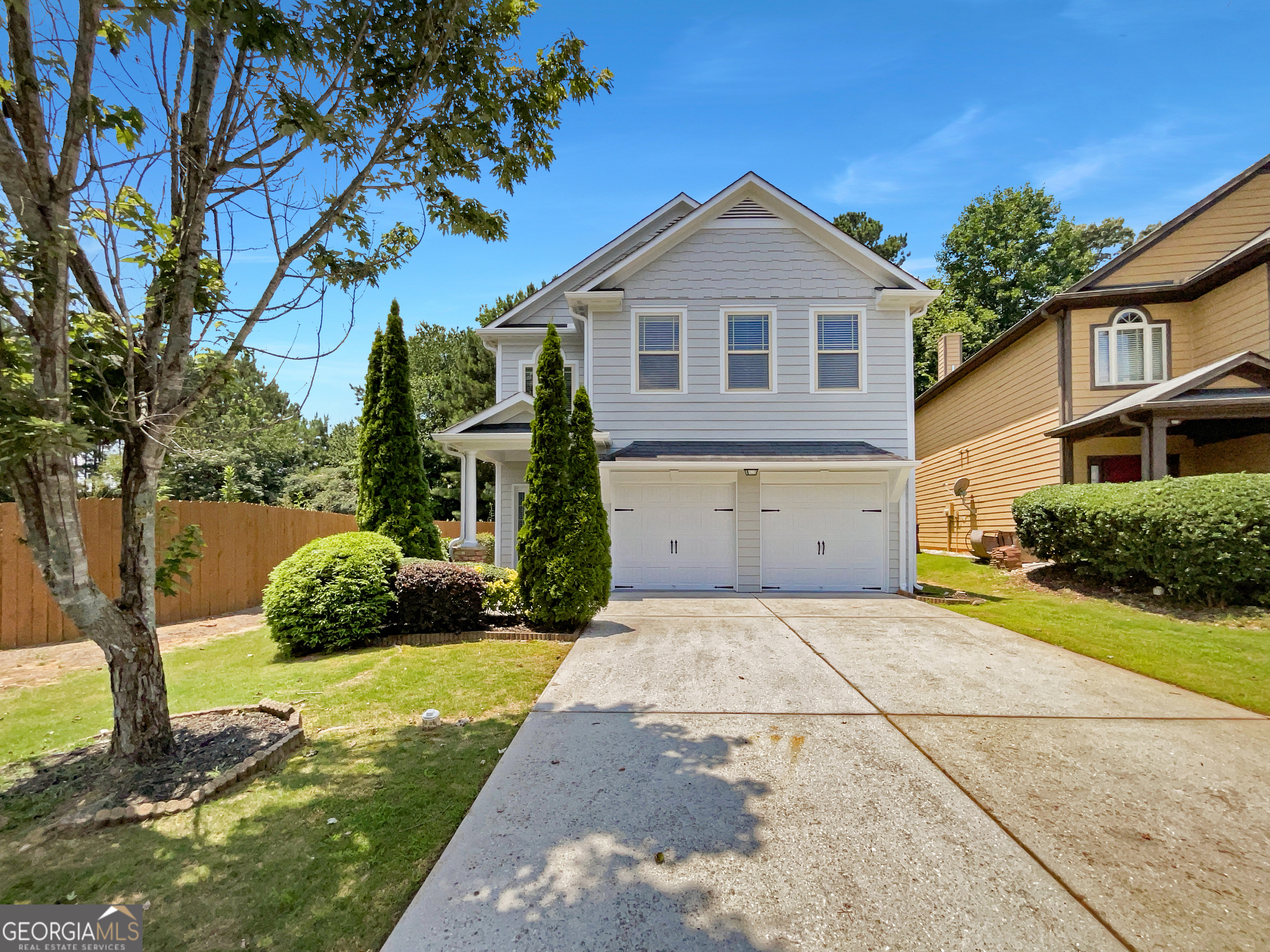 Welcome home to this beautifully updated 3-bedroom, 2.5-bathroom gem in a prime Lawrenceville location! From the moment you enter, you're welcomed by a charming foyer that opens directly into the spacious family room, the centerpiece of the home. Enjoy the warmth of the cozy fireplace and the seamless open flow into the kitchen and dining area-perfect for both relaxing evenings and entertaining guests. The well-designed kitchen features stained cabinets, a stylish tiled backsplash, a convenient breakfast bar, and stainless steel appliances, offering a great balance of function and flair. The adjacent separate dining area provides an ideal setting for hosting family meals or dinner parties. Upstairs, the generously sized primary suite offers a tranquil retreat with a tray ceiling, a walk-in closet, and a spa-inspired bathroom complete with a double vanity, soaking tub, and separate shower. Two additional bedrooms share a full bath, and the versatile loft space is perfect for a home office, study area, or playroom. The upstairs laundry room adds convenience, and the washer and dryer are included. Recent updates include brand new carpet, fresh interior and exterior paint, making this home move-in ready. Enjoy the outdoors with a low-maintenance yard and easy access to everything Lawrenceville has to offer. Located just minutes from top-rated schools, shopping, dining, parks, and major highways including I-85, Sugarloaf Parkway, and Ronald Reagan Parkway-this is the ideal place to call home. Don't miss your chance to own this fantastic property!