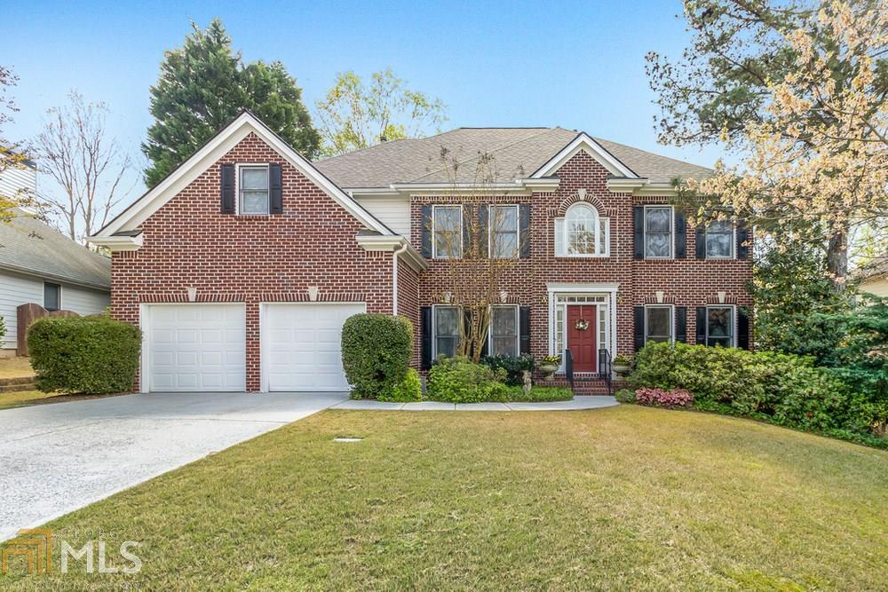 A very rare chance to purchase a stunning home with basement in one of the most popular swim/tennis communities in Smyrna. Easy access to 285 and you can walk to shops and restaurants in Ivy Walk and West Village. This home is well maintained and has a gorgeous professionally landscaped low maintenance English garden. There is a large bedroom and full bath on the main level, open floor plan, wood floors on main level, separate living and dining rooms, stacked stone fireplace, oversized master with a sitting room and huge walk in closet, composite deck overlooking the garden, fenced in back yard, newer roof, and newer garage doors.