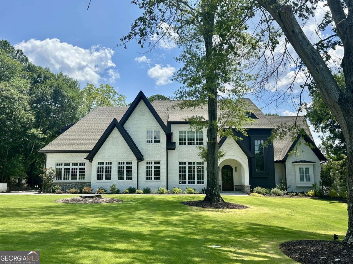 Welcome to 415 Westview Drive, a beautifully maintained newer home nestled in one of Athens' most desirable in-town neighborhoods. Just minutes from Five Points, Beechwood Shopping Center, and the University of Georgia, this classic residence offers the perfect blend of convenience, character, and comfort. Boasting nearly 6,500 square feet, this sizable estate provides plenty of space for entertaining. The modern interior offers ample appointments including hardwood floors, abundant natural light, and a flowing floor plan ideal for everyday living and entertaining. There is a finished lower level that offers a media room and ample storage spaces for expansion if desired. The backyard is a private retreat-perfect for relaxing evenings, pets, or weekend gatherings under the mature canopy.