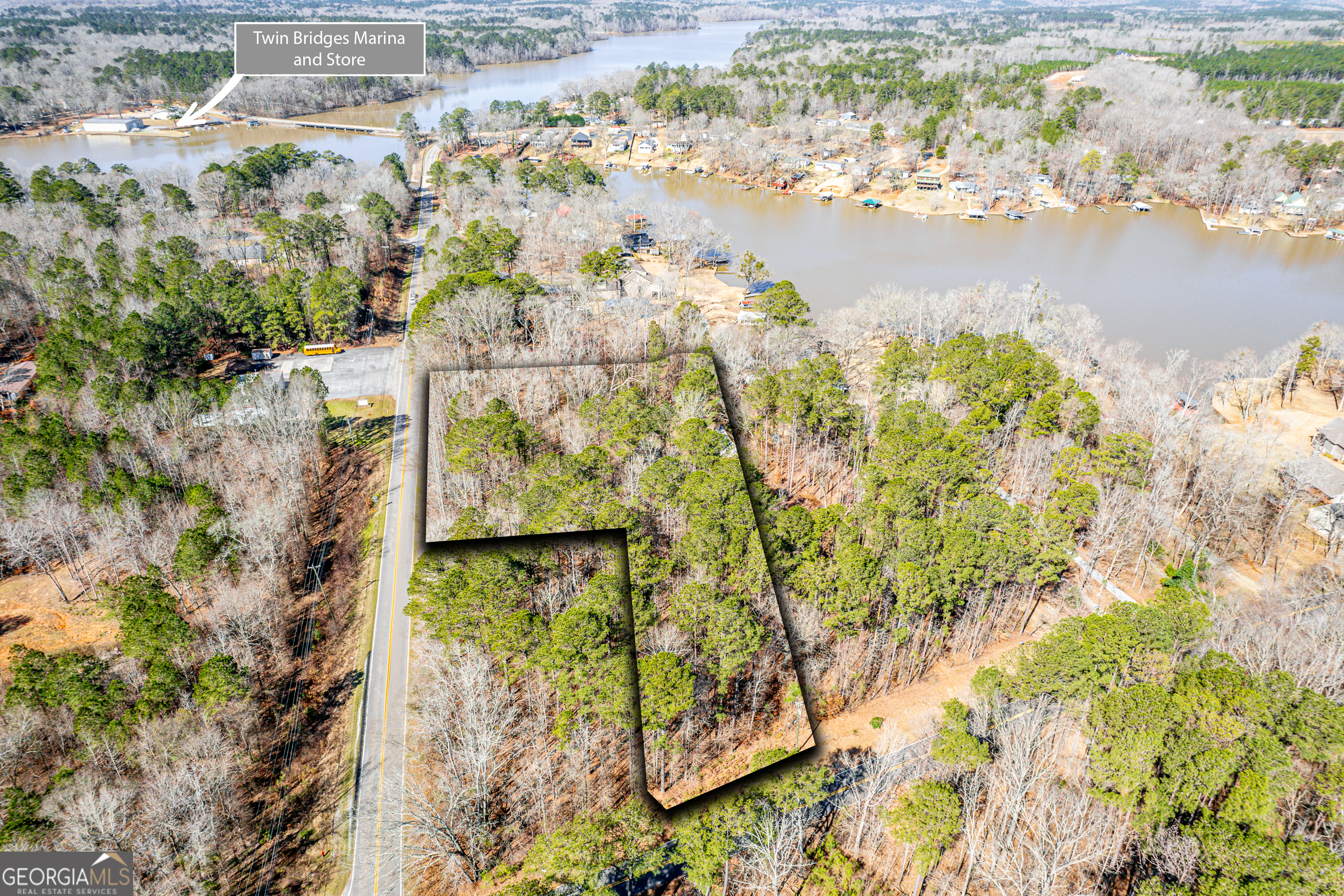 Lakefront Opportunity on Lake Sinclair - 2.5 Acres with Stunning Views! Discover the endless possibilities with this rare 2.5-acre lakefront property on the highly sought-after Lake Sinclair! This expansive double lot, tucked away in a peaceful cove, offers the perfect blend of calm waters for fishing and recreation while still boasting direct views of the big water. The property features four existing structures including a storage house near the water, cookhouse, cabin, and carport that are ready for renovation or removal-providing a blank canvas for your dream lake retreat. With easy access to shopping, dining, I-20, and Twin Bridges Marina, this location offers both seclusion and convenience. Whether you're looking to build your custom lakefront estate, renovate the existing structures, or invest in prime lake property, this is an opportunity you don't want to miss. Bring your vision and make Lake Sinclair your home!