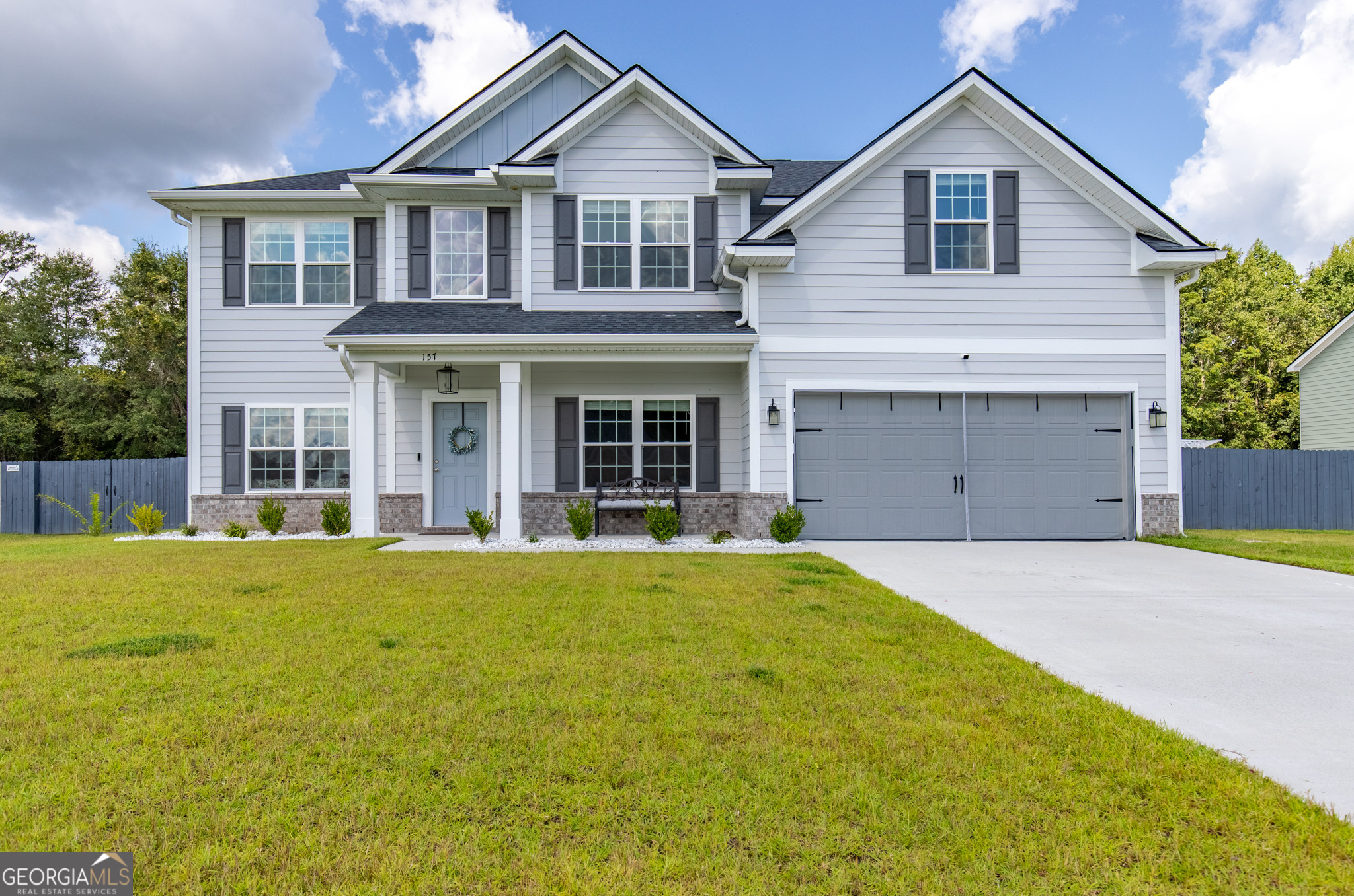 Welcome to 157 Halcyon Way NE in Ludowici's premier gated community, Palmer Place. This beautiful two-story Richland Covenant floor plan by RTS Homes offers 4 bedrooms, 2.5 bathrooms, and 2,724 sq ft of living space. Built in 2023, the home combines modern design with thoughtful details. The open layout features a spacious living area and a kitchen with granite countertops, all appliances included, a walk-in pantry, and plenty of storage. The main level also includes a mud room and a convenient powder room. Upstairs, the master suite is a true retreat with a generous sitting area, perfect for relaxing after a long day. Additional upgrades include upgraded blinds, a Vivint security system, and an all-in-one washer and dryer that stays with the home. Step outside to a beautifully landscaped yard complete with a sprinkler system, stained privacy fence, storage shed, gutters, and a cozy fire pit-ideal for entertaining family and friends. A sauna is also available as an option. Palmer Place is a gated community offering a playground for children and a dog park for your pets. This home truly has all the must-have features-schedule your private tour today before it's gone.