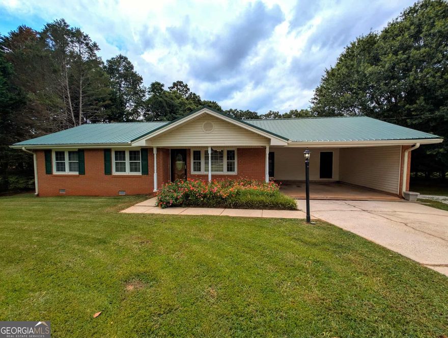 The perfect home has come along at last! This well maintained and updated 3 bedroom 2 bath home sits perfectly placed on a 1.03 acre lot in the rural part of Griffin, GA. With only a short drive to all surrounded cities you have access to McDonough, Locust Grove and Griffin at your finger tips. This lovely home has had many improvements over the years which include new porch railing and steps, new stainless steal refrigerator, new attic stairs, new driveway to access shop, recently installed carpet, New flex tube installed in skimmer with the pool liner being replaced only 3 years ago. Newly remodeled bathrooms and fresh paint throughout. Fiber WiFi is available and there is No HOA! This home also has lots of parking options with plenty of room for RV PARKING by shop in the Private backyard. Don't miss any detail like the real knotty pine floors and woodburning stove insert as you tour to see all this property has to offer. Schedule your showing today and bask in all the heart and love that has been put into this home over the years. She won't last long!