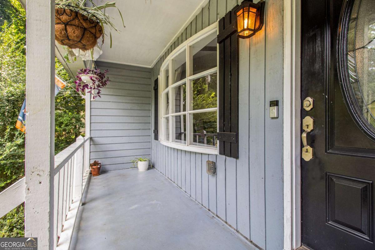Sought-After Ranch Home on a Full Basement - Recently Renovated! Welcome to this beautifully updated ranch-style home featuring a full, unfinished basement with endless potential. The chef's kitchen is a standout, boasting custom cabinetry, a farmhouse sink, double ovens, built-in microwave, kitchen island, and ample workspace. A cozy breakfast room-currently doubling as a home office-adjoins the kitchen for added flexibility. The great room and dining area showcase rich espresso hardwood floors and are highlighted by vaulted, beamed ceilings and a ceiling fan. An electric fireplace insert adds warmth and charm. Step outside to a private, fenced backyard perfect for entertaining or relaxing. All new windows throughout the home offer energy efficiency and natural light. The two spacious secondary bedrooms feature ceiling fans and share an updated bathroom with double vanities. The owner's suite includes its own ceiling fan and a renovated en-suite bathroom. The expansive basement is ready for your custom finish-whether it's a media room, home gym, workshop, or additional living space. Additional Features: No HOA Fenced backyard Minutes to I-575 Close to downtown Woodstock with restaurants, breweries, festivals, shopping, and parks Located near Dupree Park with 18-hole disc golf, fitness stations, pickleball & tennis courts, playground, fishing pond, and more Award-winning school district This home truly offers it all-style, location, and room to grow!