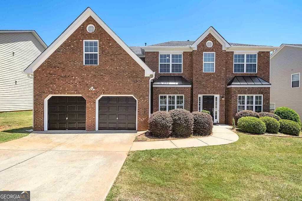 Welcome to this beautifully maintained 5-bedroom, 3-bathroom home located in a desirable neighborhood of McDonough, Georgia. This spacious and inviting residence combines comfort, style, and functionality, perfect for families, remote workers, or anyone seeking a peaceful suburban lifestyle. Step inside to discover a bright and airy open-concept floor plan, complete with a generously sized living area, a modern kitchen with ample cabinetry, and a cozy dining space ideal for entertaining. The primary suite offers a relaxing retreat with its private ensuite bath and walk-in closet, while four additional bedrooms provide flexibility for guests, home offices, or play areas. One of the standout features is the side-entry two-car garage. The beautifully landscaped yard and private backyard create a perfect setting for outdoor gatherings, gardening, or relaxing under the stars. Conveniently located near shopping, dining, parks, and top-rated schools, with easy access to I-75, this home offers one of the best of McDonough living.