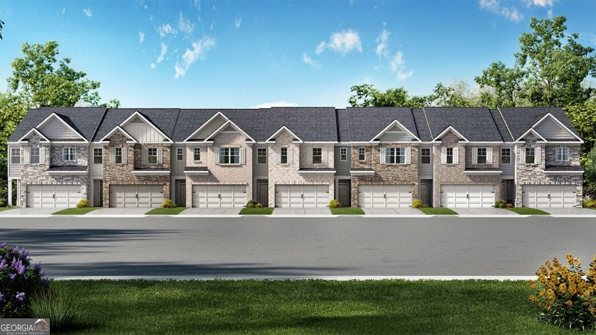 Welcome to 4441 Manor Hill Drive, a stunning new townhome in Union City, GA's newest community, Pointe Park. This two-story townhome offers 1,877 sq. ft. of living space with a 2-car garage and the flexibility of either 3 or 4 bedrooms with 2.5 bathrooms. Step inside from the front porch into an inviting foyer that leads to the open-concept main living area. The spacious family room is the perfect place to gather with family and friends or enjoy a cozy evening at home. The modern kitchen overlooks both the family and dining areas featuring a Center Island with seating, Granite countertops, 4" granite backsplash, Shaker-style cabinetry with soft-closing doors and Stainless steel appliances. A dining area just off the kitchen opens to the backyard patio, creating the ideal space for indoor-outdoor living. A conveniently located half bath completes the main floor. Upstairs, the primary suite serves as a relaxing retreat with Large bedroom space, En suite bath with dual vanity, Separate soaking tub, Walk-in shower, Private water closet and Spacious walk-in closet. Across the landing, the 3 bedroom plan includes a versatile loft space. Two secondary bedrooms, a full bathroom with dual vanity and upstairs laundry round out the second floor. Do not miss the opportunity to own this beautiful townhome at 4441 Manor Hill Drive. Contact us today to learn more about making this home yours and see the community in which it resides, Pointe Park.