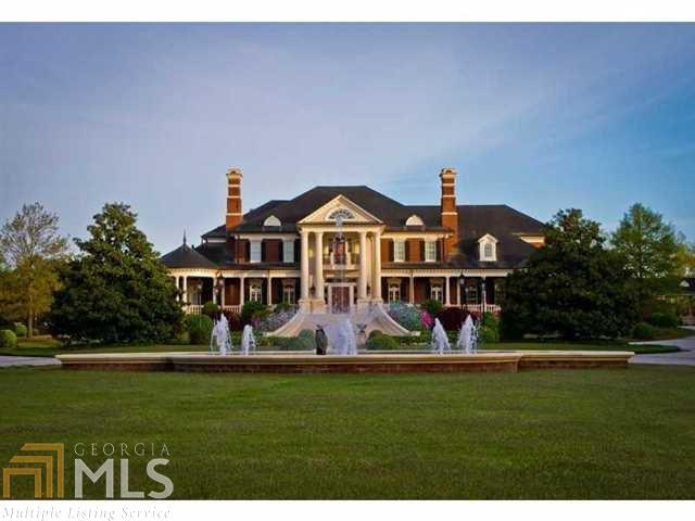 Spectacular gated custom estate on 14 acres with magnificent interior details. This home has a 14 car garage, separate pool house, 5 kitchens, 20 HVAC units, 3 laundry rooms, saltwater pool with outdoor fireplace, attic with custom cabinetry, elevator, service access driveway. House is electronically controlled. Custom built but owner never moved in. Every piece of woodwork is custom and each piece of stone carefully selected. Too many details to possibly describe - this is a masterpiece of construction. Underground tunnel connects detached garages with main house.