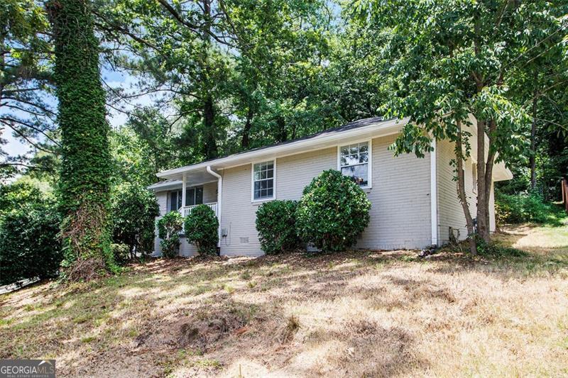 This move-in ready ranch-style home features a 3/2 layout, a covered carport, and plenty of backyard space. The single-level design offers practical living with well-maintained finishes throughout.