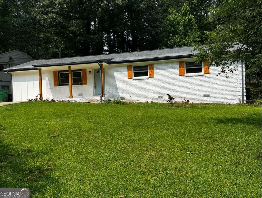 Welcome to this beautifully renovated 3-bedroom, 3.5-bath ranch-style home, nestled on a private cul-de-sac in the desirable, established neighborhood of Battle Forest. This home offers the perfect blend of modern updates and functional design, with a layout ideal for both everyday living and entertaining. Step inside to find refinished hardwood floors throughout and fresh interior paint that gives the home a crisp, modern feel along with updated lighting. The spacious primary suite features an en-suite bathroom with a gorgeous tiled shower. The updated kitchen boasts white cabinetry, stainless steel appliances, and flows seamlessly into the dining and family rooms-creating a bright and open living space. A dedicated home office off the living area provides the perfect environment for remote work or creative projects. The generously sized laundry/mudroom includes its own private entrance and is large enough to double as a second pantry space. Major system updates completed include: roof, gutters, HVAC, and kitchen appliances. Conveniently located minutes from major interstates with quick access to Hartsfield-Jackson Airport, Downtown Atlanta, and Downtown Decatur.