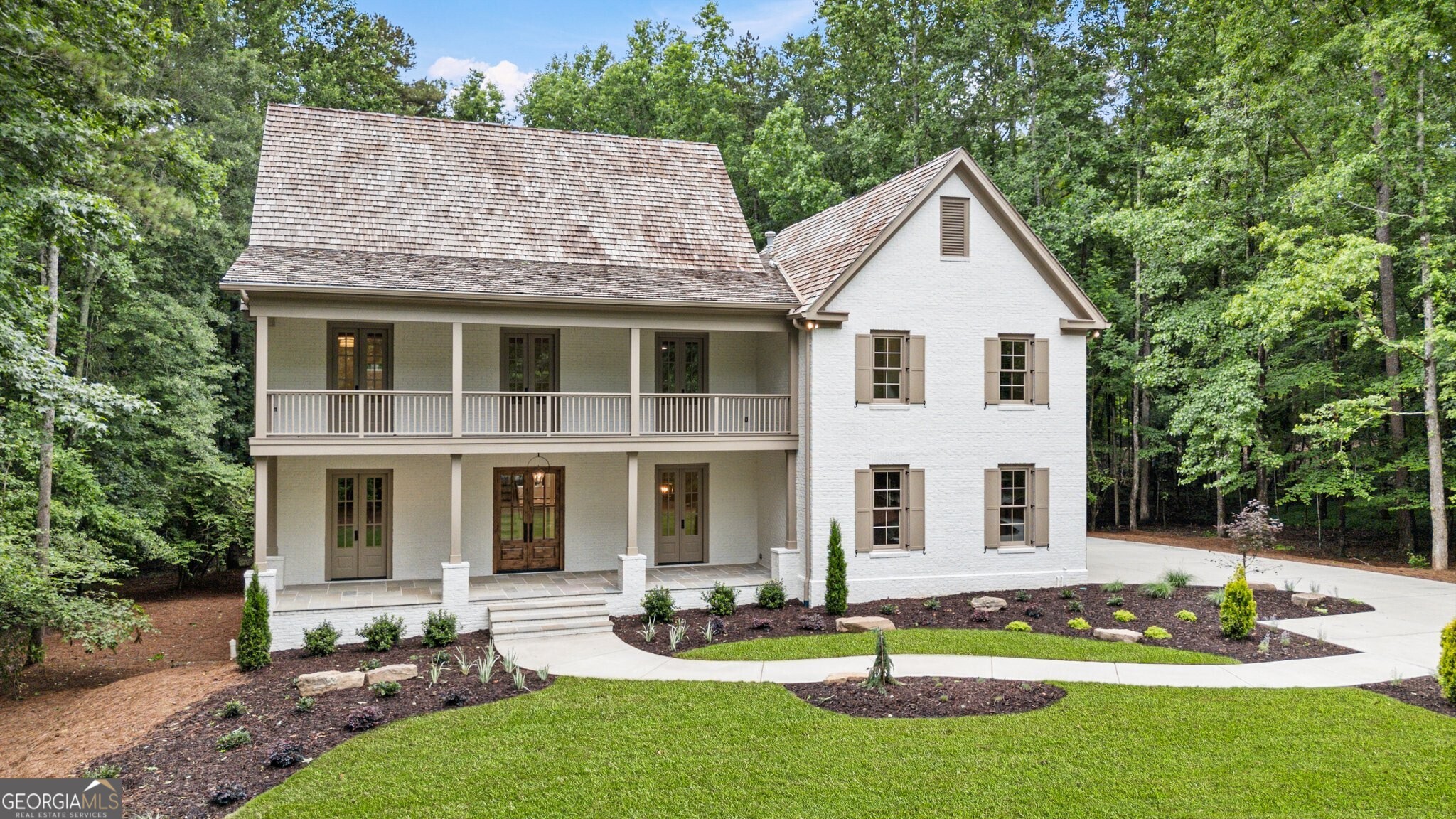 Discover Unparalleled Luxury in the Coveted North Valley Community! Welcome to your dream home nestled on a stunning 2.42 acre private wooded lot in Milton's prestigious North Valley community. This exquisite residence has been meticulously renovated by Crownline Homes and offers an extraordinary living space featuring a timeless 4-sided brick structure with a beautiful cedar shake roof. As you enter this luxurious haven, you'll be captivated by the expansive, open layout, highlighted by soaring 10-foot ceilings on the main floor and 9-foot ceilings upstairs. The main level is thoughtfully designed with a lavish primary suite that includes a spacious walk-in closet and a convenient laundry stack, providing the ultimate blend of comfort and practicality. An additional primary suite on the second floor ensures versatility for family and guests alike. The heart of this home is the state-of-the-art kitchen featuring custom cabinetry, Taj Mahal quartzite and new 48" Wolf range and Thermador appliances, perfect for culinary creations. Gather around the large island or relax in the beautiful family room with vaulted beamed ceilings and views of your serene and natural outdoor oasis. Every detail has been considered in this renovation with interior upgrades including new hardwood floors throughout the main and second level, custom trim work, and modern lighting fixtures. The primary bathroom features a luxurious zero-entry shower, complemented by elegant aged brass fixtures and a free-standing tub. Each space has been carefully thought out for functionality, without compromising luxury. Upstairs you will find four spacious bedrooms with walk-in closets. One bedroom has an ensuite bathroom completely updated, while two additional bedrooms share a jack and jill updated bathroom. The fourth bedroom upstairs is an additional primary suite or guest room with a spacious walk-in closet and a true bathroom suite with dual vanities, separate water closet, and oversized shower. The second level laundry room is complete with a sink, cabinetry and folding space. The third level offers a wonderful bonus space perfect for a golf simulator, home gym, playroom or media space. Don't miss the finished terrace level complete with a full bathroom, recreation room to be used as your media space and additional space for a craft room or fitness studio as well as a workshop. Walk outside and enjoy the tranquility of nature with newly landscaped grounds, a freshly painted exterior, and a welcoming front porch adorned with smooth cedar railings. The new insulated garage doors, equipped with advanced lift systems provide both convenience and security and a brand new driveway that compliments the beautiful elevation and meticulous landscaping. This home is also energy-efficient featuring two new 95% efficiency Trane HVAC units, new Sierra Pacific aluminum clad windows and hardwood exterior doors throughout with Low-E glass, and enhanced open cell spray foam insulation in the attic level of the home. Smart technology includes Moen Flo water leak detection for peace of mind, smart thermostats for energy management, and hard-wired smoke and carbon monoxide detection for safety. Experience the pinnacle of luxurious living in the heart of Milton and enjoy this community that offers walking and equestrian trails, lake and the charm of the Milton community with top ranked schools. Schedule your private tour today and make this exceptional property your forever home!