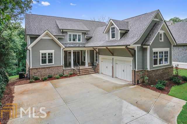 Killer new construction, just completed, with rare master BR on the main! Luxury builders did it all with special finishes only seen in 1M+ construction! Kitchen w/Danby Marble and Dacor applcs., outdoor covered screen porch w/frplc, and a master ste that will knock your socks off. Small boutique n'hood with walkable score of 10, minutes from new proposed city center and parks. Close to interstates, shopping and restaurants in Riverwood HS district. HOA takes care of all lawn care!