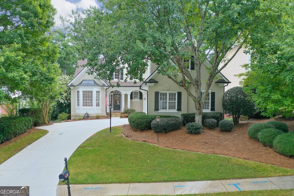 This beautifully maintained home in the Gleneagles neighborhood of Windward is spectacular! Newly refinished hardwood floors and fresh paint throughout the main level, a new roof, a new driveway and recently replaced HVACs (2023) are just a few of the appealing features of this home. The primary suite on the main level has a large walk-in closet with built-in storage organizers and shelving. The primary bathroom has been completely renovated featuring his/her vanities with quartz, a beautiful custom tile shower, leaded glass window, a gorgeous chandelier and a free-standing tub....it is stunning! The island kitchen is updated with new counters and back splash and is open to the breakfast area and keeping room. Also on the main level is a vaulted, two-story great room with a wall of windows overlooking the private back yard with beautiful landscaping. Additionally on the main level is a vaulted formal dining room, powder room and a laundry room w/utility sink. Upstairs are two, spacious bedrooms and a huge bonus room! The finished, daylight terrace level has an oversized rec room, craft room, full bath and plenty of unfinished areas for storage. Other features include a large, freshly painted deck, irrigation system and a retreat/repair termite bond. Windward is a golf and lake community with swim, tennis, and parks close to both Avalon and downtown Alpharetta.