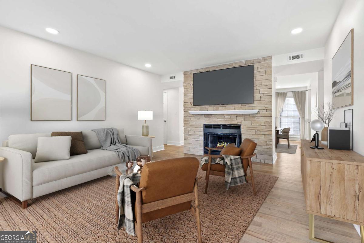 Just minutes from Marietta Square, this beautifully renovated 2-bedroom, 2-bath condo offers comfort, style, and convenience in a gated community with a pool and dedicated parking. Featuring brand-new luxury vinyl plank flooring, fresh paint, granite countertops, white shaker-style cabinets, and all-new appliances, the home combines modern upgrades with thoughtful design. The split roommate floor plan ensures privacy, with each spacious bedroom offering its own bathroom and walk-in closet, while the cozy living room with fireplace flows into a dedicated dining area and bright sunroom filled with natural light. Situated on the second floor with no neighbors above, this move-in ready condo provides peace and quiet while still being close to shopping, dining, and parks. Don't miss your chance to own this updated home in a prime Marietta location-schedule your showing today!