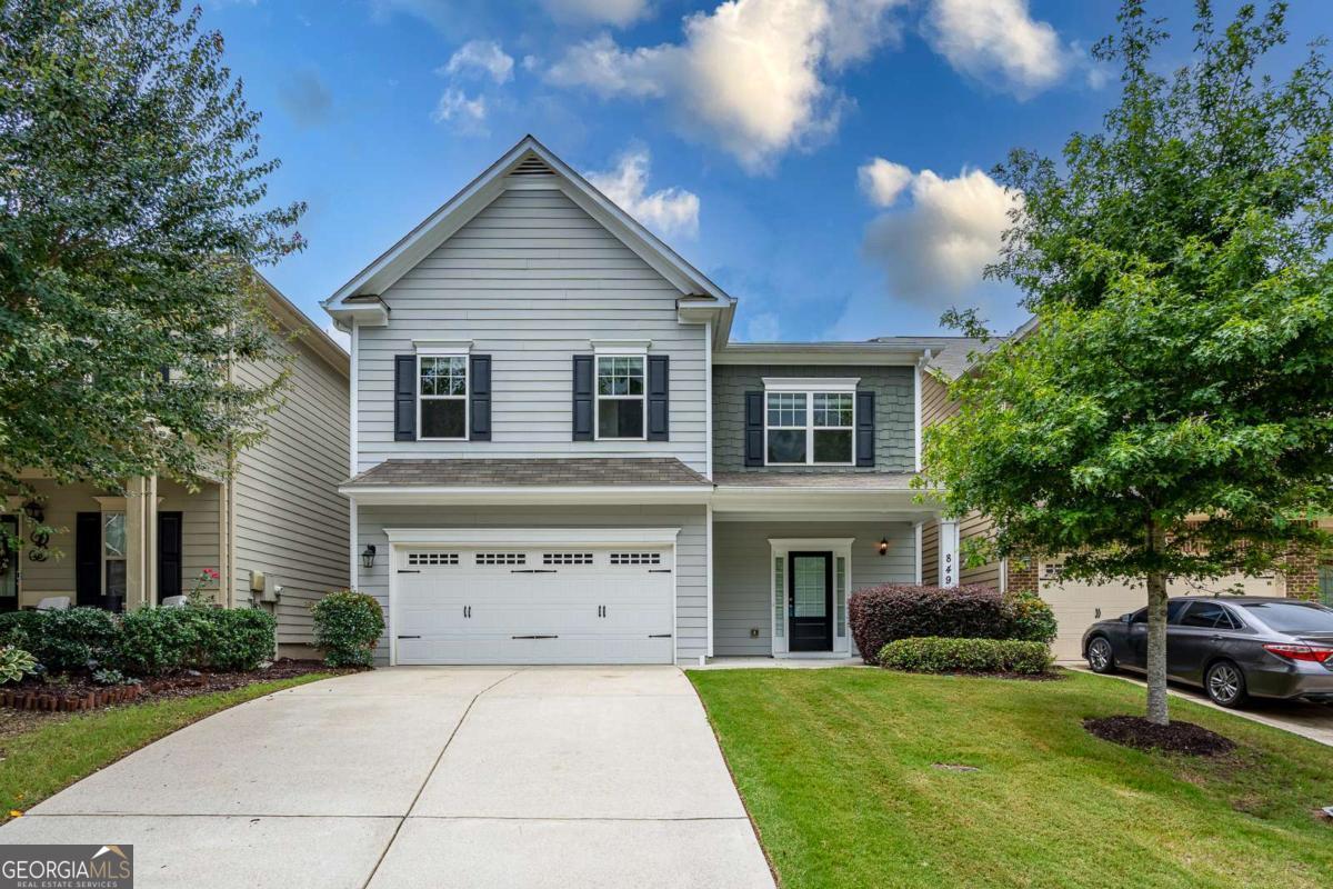 Your search is over! Beautifully updated and move-in ready, this 4-bedroom, 2.5-bath townhome in the gated Tyson Woods community offers space, comfort, and peace of mind. Recent investments include over $10K fresh interior paint throughout, brand-new carpet upstairs, and normal repairs and maintenance have been taking care of making this home feel like new. The open-concept main level features hardwood floors, a spacious family room with fireplace, and a well-equipped kitchen with granite countertops, stainless steel appliances, and a large island. Upstairs you'll find a generously sized primary suite with walk-in closet and en-suite bath, along with three secondary bedrooms and a convenient upstairs laundry room. Located on a quiet street within a private, well-maintained community, Tyson Woods offers sidewalks, open green space, and a secure, family-friendly environment. HOA includes lawn maintenance and trash service for low-maintenance living. Easy access to I-75, shopping, restaurants, and top-rated schools - this one checks all the boxes. Location is close to everything! Doesn't need a thing. Agent answers all texts within minutes...schedule your showing today 770-765-2222
