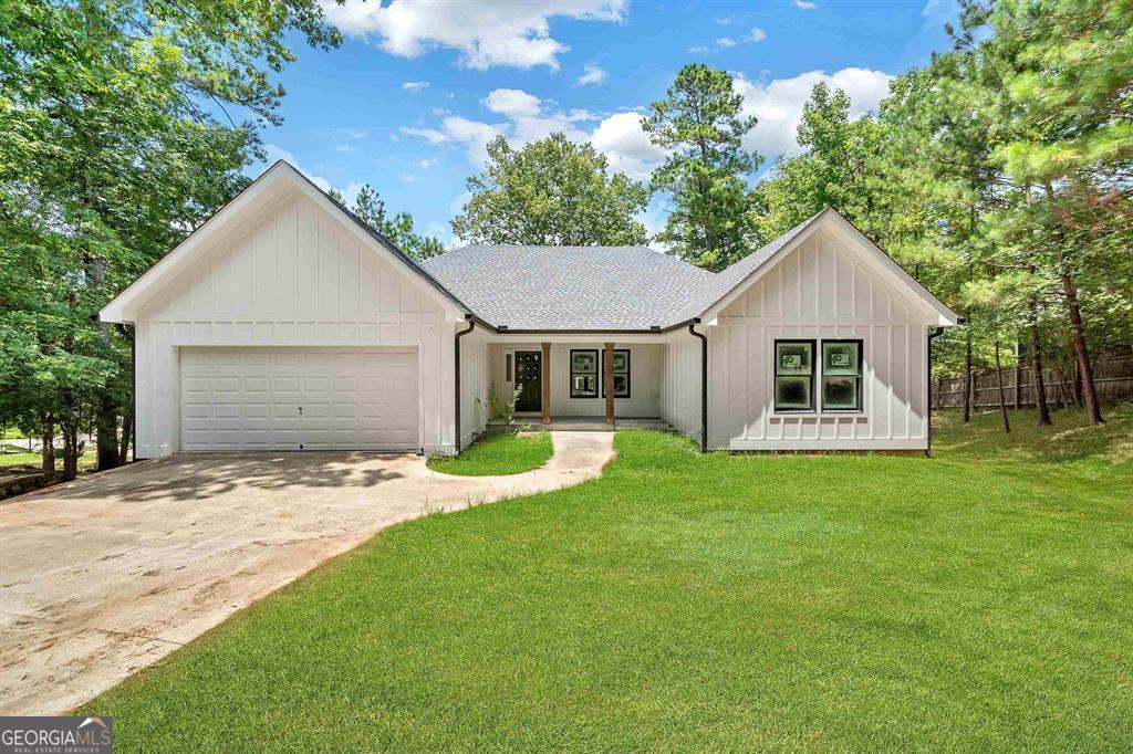 Make this your dream home on magnificent Lake Oconee! This soon-to-be fully remodeled craftsman home offers breathtaking lake views. Featuring 2 bedrooms and 2.5 baths on the main level. 2 additional bedrooms and 1 full bath in the fully finished basement. Enjoy the large family/rec room featuring a wet bar, ideal for entertaining. Step outside to your relaxing deck designed for outdoor enjoyment. The property also boasts a brand-new max dock and seawall, ensuring your waterfront experience is second to none. A 2-car attached garage and premium lakefront amenities, 1120 Kings Row is your ultimate lakeside escape. Don't miss this opportunity to own a piece of paradise on Lake Oconee!