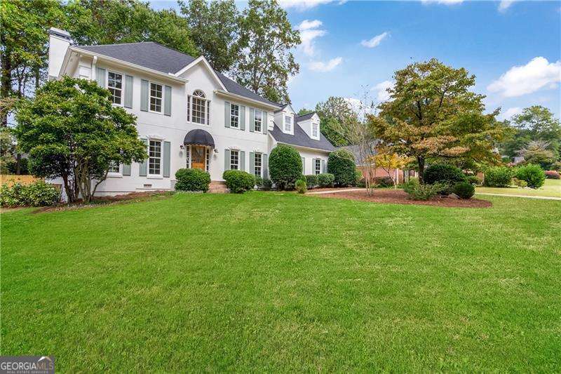 Welcome to 978 Denmeade Walk, a home that blends timeless design with modern comfort in one of Marietta's most sought-after neighborhoods. Featuring 4 bedrooms and 2.5 bathrooms, this sun-drenched residence is wrapped in engineered hardwood floors and designed to inspire both everyday living and effortless entertaining. At the heart of the home, the designer kitchen offers abundant cabinet space, premium finishes, quartz countertops and a seamless connection to the living room, where stunning white oak beams create warmth and architectural charm. Expansive windows frame each space, filling the home with natural light. The primary suite is a retreat of its own-featuring a spacious sitting room, his-and-her closets and vanities, designer tile details, and a soaking tub overlooking the private backyard. Secondary bedrooms are generously sized, making this home as functional as it is stylish. For peace of mind: a brand new roof, new windows, and a newer HVAC system all add to its long-term value. Outdoors, enjoy a flat, usable backyard with a brand new deck-perfect for morning coffee, weekend barbecues, or gatherings with friends and family. Set within an established and highly sought-after community, 978 Denmeade Walk offers not just a house, but a lifestyle of comfort, style, and connection.