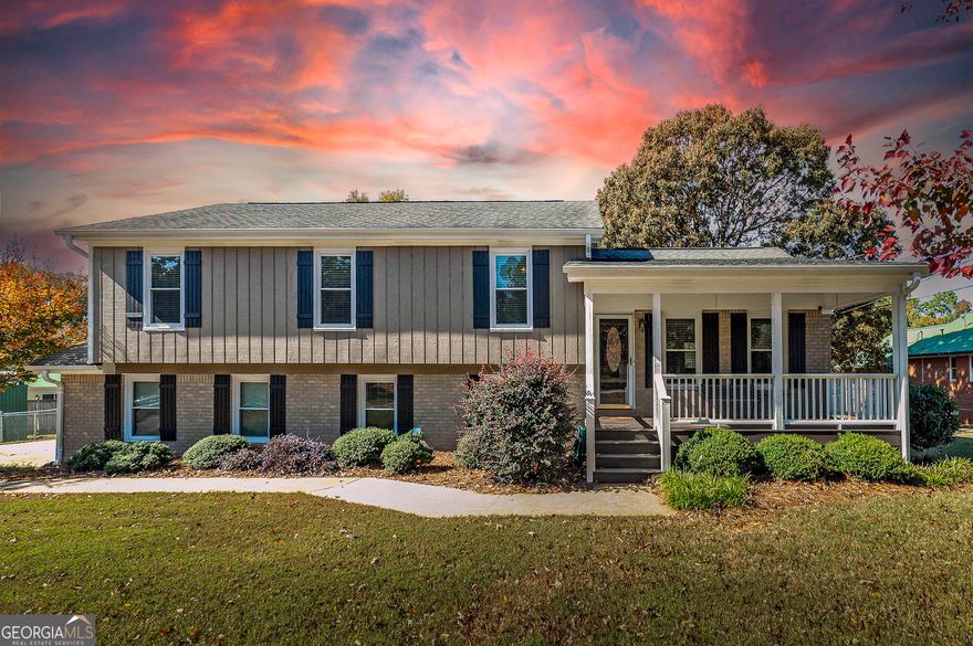 NEW LISTING!! Just in time move in before the Holidays! NO HOA!! This spacious 4 bedroom, 2 full bath split level floor plan features a rocking chair front porch situated on a level lot that's conveniently located close to shopping, restaurants, doctors offices, schools and easy access to I-75 where you're less than 30 miles to the Atlanta Airport.  Upgrades include neutral paint throughout, hardwood floors, updated light fixtures including can lighting. The large kitchen is amazing! It includes granite countertops, tile backsplash, stainless steel appliances with a high end gas range & vent hood, a ton of oak cabinets and a prep cabinet with a separate built in sink.  The oversized primary bedroom will accommodate a king size bedroom suite, the ENORMOUS closet is literally large enough to set up a small office, or it would be perfect for a nursery. The primary bath has tile floors, a large separate tiled shower, a jetted tub, double vanities with granite counters, and updated lighting. The lower level has a SECOND family room with a cozy wood burning stove, knotty pine tonge and groove ceilings, a large laundry room plus a bonus room that could be another office or work out space.  The huge back deck overlooks a private fenced in back yard with an outbuilding that's perfect space for storing your outdoor tools. This community has friendly neighbors, it's quiet and has NO HOA! Note, the square footage is quoted from tax records and must be confirmed through an appraisal process.