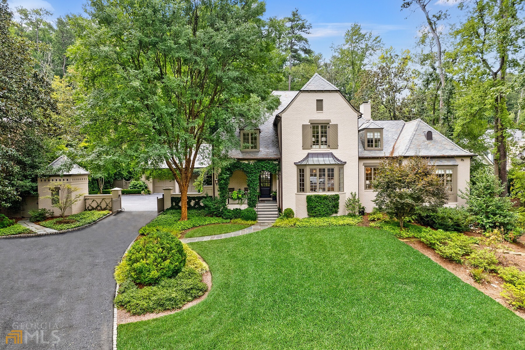 Designed by Stan Dixon and built in 2003, the home sits on 1.5 acres in sought-after Tuxedo Park. The home welcomes you with a large foyer leading to the formal living room, separate formal dining room with a fireplace and French doors opening to the outside covered patio. The updated beautiful kitchen overlooks the breakfast area and family room, which features stunning views to the landscaped backyard and pool. The main level is complete with owner's suite with sitting room, dual vanities and separate his and her closets. Three bedrooms, each with their own ensuite bathrooms and a bonus room complete the second level. Full basement with one bedroom and bathroom, wine cellar, gym and tv room make it the perfect place for entertaining. Above the two-car garage is an unfinished, stubbed space which would make the perfect area for a future office or private guest room. The turfed backyard is a beautiful oasis with pool, hot tub, and the current owners had Pak Heydt reimagine the entire backyard, adding a wonderful large outdoor pavilion with barbecue area, fire pit, putting green and chicken coop.