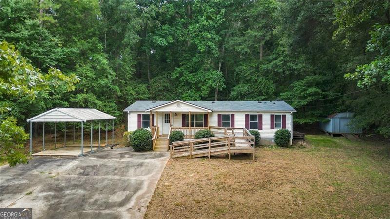 **Seller is willing to provide an appliance package** including oven/range, dishwasher and refrigerator.** Charming 3BR/2BA Mobile Home Near Lake Hartwell - Recently Remodeled! Welcome home to this adorable and fully updated 3-bedroom, 2-bath mobile home just minutes from beautiful Lake Hartwell! Bursting with charm and style, this move-in-ready gem offers comfort, convenience, and a touch of rustic elegance. Step inside to find an inviting open floor plan with fresh updates throughout. The kitchen features stylish butcher block countertops, modern fixtures, and ample cabinet space - perfect for cooking and entertaining. The spacious living area flows seamlessly into the dining and kitchen spaces, creating a warm and welcoming atmosphere. The primary suite offers generous closet space and a private bath, while two additional bedrooms provide flexibility for family, guests, or a home office. Outside, enjoy the peace and quiet of the surrounding area with a metal carport to keep your vehicle protected from the elements. Whether you're looking for a full-time residence, weekend getaway, or investment opportunity, this home checks all the boxes. Highlights: 3 Bedrooms, 2 Full Baths Recently Remodeled Interior Butcher Block Countertops Cute, Cozy, and Full of Charm Metal Carport Included Minutes to Lake Hartwell Boat Ramps & Recreation Don't miss your chance to own this charming home in a fantastic location. Schedule your showing today!