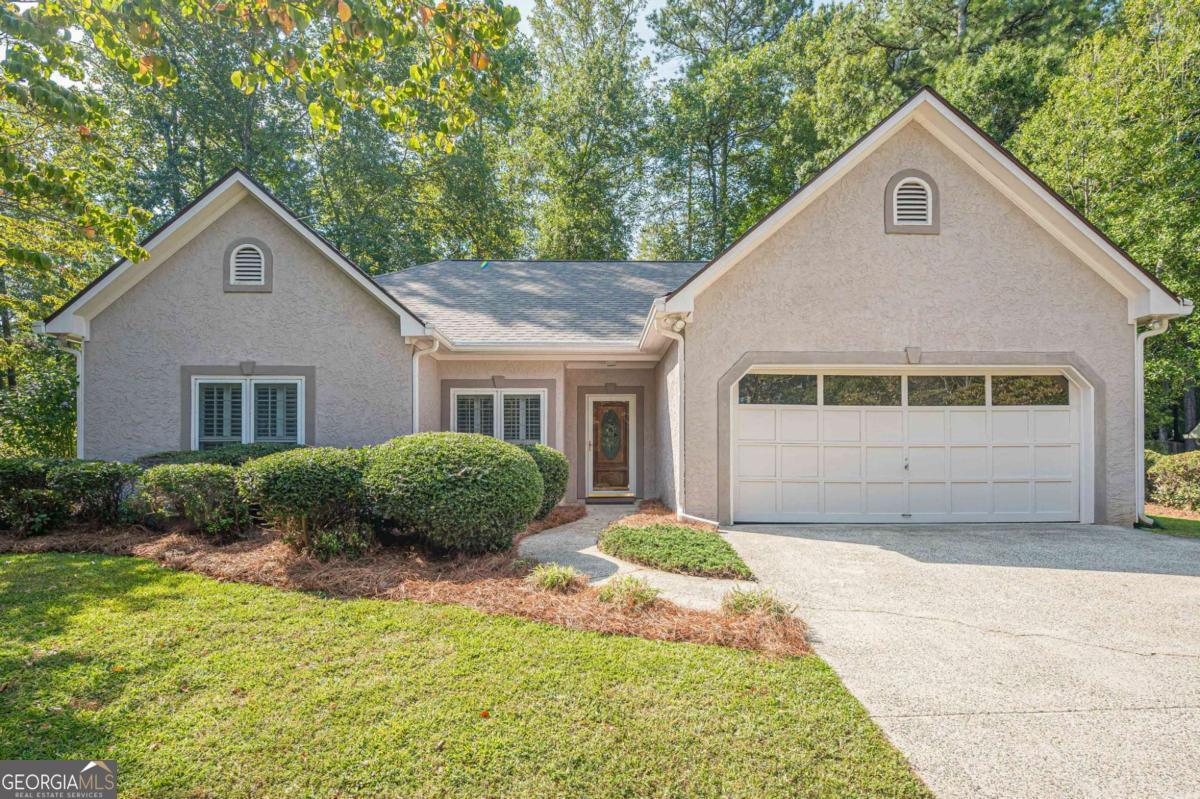 Welcome Home to this Move-In Ready Stepless Ranch, Featuring New Roof, Hardwood Floors, Brand-New Carpet, and Plantation Shutters Throughout! The Inviting Living Room Features a Classic Brick Fireplace - Perfect for Cozy Evenings at Home. The Formal Dining can also be used as Flex Space for a Home Office. The Bright Kitchen Offers Ample Counter Space and Storage, Freshly Painted Cabinetry, Stainless Steel Appliances, and Brand-New Flooring. A Generously Sized Main Bedroom Offers a Peaceful Retreat with Beautiful Tray Ceilings that Add a Touch of Elegance, Windows Provide Plenty of Natural Light, Creating an Inviting and Open Feel, an Ensuite Bathroom Features a Separate Tub/Shower and Vanity, Oversized Laundry Room for Added Convenience, Step Outside to a Beautiful, Private Backyard with a Park-Like Setting - Perfect for Relaxing or Entertaining. An Outbuilding Offers Additional Storage to Suit Your Needs. Don't Miss This Move-In-Ready Gem!