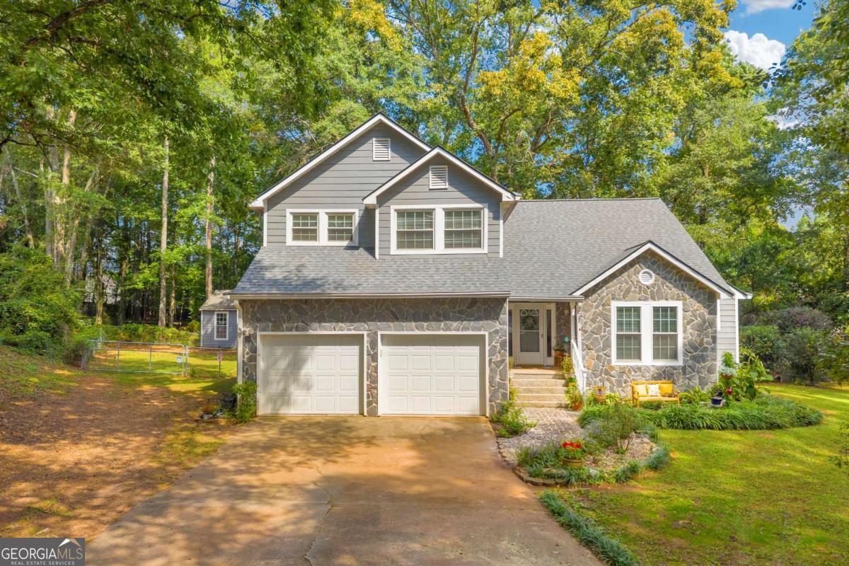 Do you like quiet, NO HOA, cul-de-sac living? Do you dream of having chickens, and a space for animals on your property? If so, 101 Elberta St is for you! This 3 bedroom, 2.5 bathroom home sits on a sprawling, private, 1 acre lot perfect for outdoor living. The yard features a large shed, a chicken pen, and plenty of room for gardening, animals, or simply enjoying the open space. Inside you'll find a main-floor Primary Suite for easy living, along with a bright Sun Room where you can relax and enjoy the outdoor scenery, a dedicated Office, and even a Wet Bar with a mini drink fridge. The main level also includes laundry and a spacious garage. Upstairs you'll find two additional bedrooms, a full bathroom, BRAND NEW FLOORING on the stairs and second level, plus a large walk-in attic for storage. With a BRAND NEW ROOF (less than a month old), FRESH PAINT, and unique spaces for work, play, and entertaining, this home offers both comfort and character. Schedule your showing today!