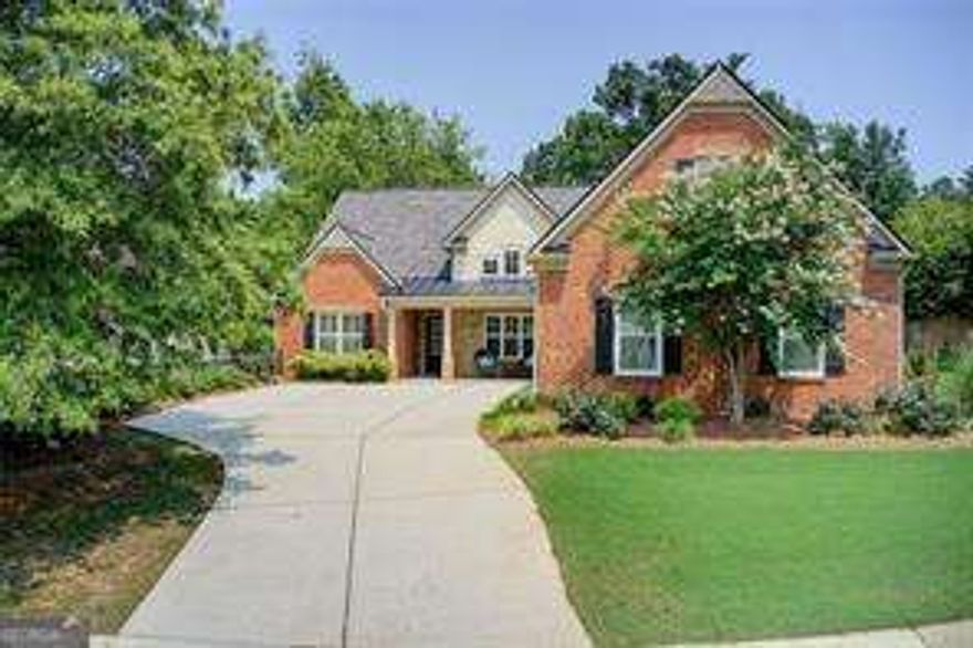 Discover comfort, connection, and convenience in this beautifully maintained Buford home. Set within a quiet Hall County neighborhood, this residence blends serene living with exceptional access to the best of North Georgia.  Located just minutes from Downtown Buford, Downtown Flowery Branch, and Lake Lanier, you can enjoy local dining, coffee shops, and entertainment within easy reach. Hall County's lower taxes and access to the Buford City School District offer a unique advantage for those seeking both value and quality.  Inside, the home features a spacious living area centered around a cozy fireplace, a separate dining room, and a bright kitchen with a breakfast nook. A generous bonus room with a private bath provides flexible options for guests, work, or recreation.  Outdoors, the space is designed for relaxation and easy enjoyment. A built-in grilling station, swing bench, and covered sitting area create a welcoming retreat ideal for gatherings or quiet evenings. With thoughtful curb appeal and low-maintenance landscaping, this property offers beauty and simplicity in equal measure. This Buford residence represents an opportunity to enjoy peaceful surroundings, modern comfort, and a location that keeps everything you love within reach. Seller will offer buyer a 2-year interest rate buydown with acceptable offer.