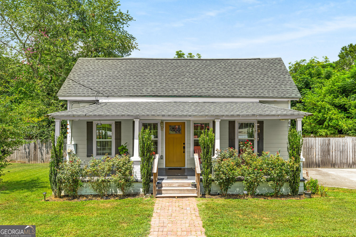 This beautifully renovated bungalow blends charm with modern updates from top to bottom. Welcome guests on the spacious front porch, perfect for relaxing. The sunlit kitchen features stainless steel appliances, quartz countertops and offers generous space for cooking and gatherings. Step outside to the wraparound back deck-ideal for grilling or unwinding. The level, fenced backyard provides plenty of room for play, gardening, or pets. The primary bedroom includes a private bath with a walk-in shower, while the guest bedroom offers flexibility as a home office or bonus space. A long driveway provides ample parking. Conveniently located near I-20, dining, shopping, and schools-this move-in ready home is just waiting for you to make it your own.