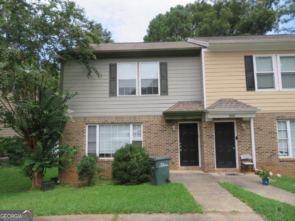Beautiful townhome in Manning Place subdivision! End unit with brick accents! Spacious living room! Separate dining/breakfast area! Kitchen features white cabinets, black stone counters, and stainless steel appliances! Half bath on main! Primary bedroom includes private bathroom with extended vanity! Two spacious secondary bedrooms share another full bathroom! Rear deck overlooks backyard! A must see! Don't miss out!