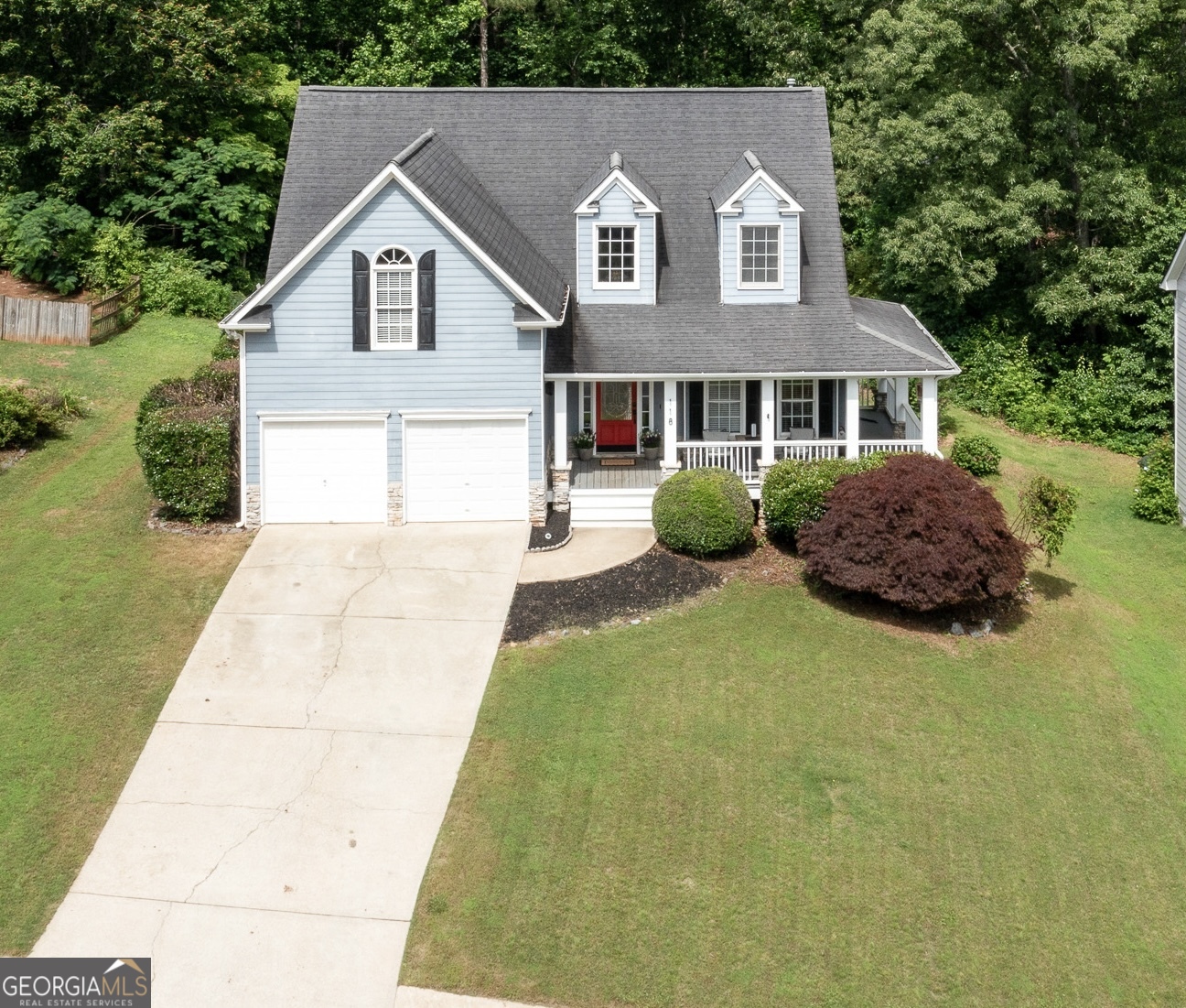 Welcome to this beautifully maintained and move-in-ready home that blends timeless charm with modern functionality. From the moment you arrive, you'll be captivated by the inviting wrap-around front porch-recently painted-setting the tone for the comfort and elegance found throughout. Step inside to a grand two-story foyer that opens to gleaming hardwood floors and thoughtful architectural details. The galley-style kitchen offers a spacious pantry, a separate breakfast area, and a formal dining room-perfect for both casual meals and elegant entertaining. The expansive family room, anchored by a cozy fireplace, provides an ideal setting for gatherings or relaxing evenings at home. A spacious main-level primary suite adds both comfort and convenience, while the upper level offers three generously sized secondary bedrooms. The finished basement extends the living space with two potential bedrooms, a large recreation room, and additional storage-perfect for guests, hobbies, or a home office setup. Outside, enjoy the beautifully landscaped surroundings from the freshly painted wrap-around front porch or the oversized rear deck, which is ideal for entertaining. And don't miss the luxurious hot tub-your private retreat for relaxation. This exceptional property offers space, style, and versatility in every detail. Don't miss your opportunity to call this stunning home your own!