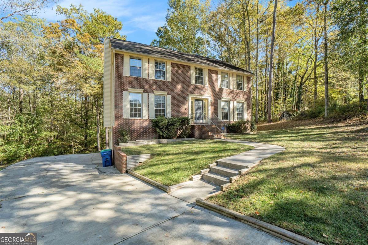 Imagine a home designed for real life, stylish, functional, and full of light. That is what you will find at 145 Shadybrook Lane SW, a beautifully renovated three bedroom, two and a half bath home on just over three acres in a quiet cul de sac in Southwest Atlanta. Each room is thoughtfully defined, offering cozy and separate spaces for everyday living and entertaining.    The main level includes a convenient half bath and laundry area, while the family room features a warm fireplace and access to a deck that also connects to the kitchen, making indoor and outdoor living seamless. The kitchen provides stainless steel appliances, sleek cabinetry, and ample counter space for cooking and hosting gatherings. Upstairs, the primary suite includes a versatile bonus room that can serve as a home office, nursery, or private sitting area.    Additional features include a one year old HVAC system, a two and a half year old water heater, and a two car garage with extra attached space for storage. Located close to shopping, dining, and major highways, this home offers the perfect balance of privacy, functionality, and convenience. Move in and make it yours today.