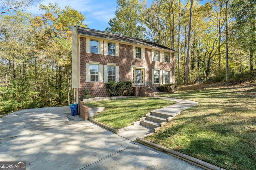 Imagine a home designed for real life, stylish, functional, and full of light. That is what you will find at 145 Shadybrook Lane SW, a beautifully renovated three bedroom, two and a half bath home on just over three acres in a quiet cul de sac in Southwest Atlanta. Each room is thoughtfully defined, offering cozy and separate spaces for everyday living and entertaining.    The main level includes a convenient half bath and laundry area, while the family room features a warm fireplace and access to a deck that also connects to the kitchen, making indoor and outdoor living seamless. The kitchen provides stainless steel appliances, sleek cabinetry, and ample counter space for cooking and hosting gatherings. Upstairs, the primary suite includes a versatile bonus room that can serve as a home office, nursery, or private sitting area.    Additional features include a one year old HVAC system, a two and a half year old water heater, and a two car garage with extra attached space for storage. Located close to shopping, dining, and major highways, this home offers the perfect balance of privacy, functionality, and convenience. Move in and make it yours today.