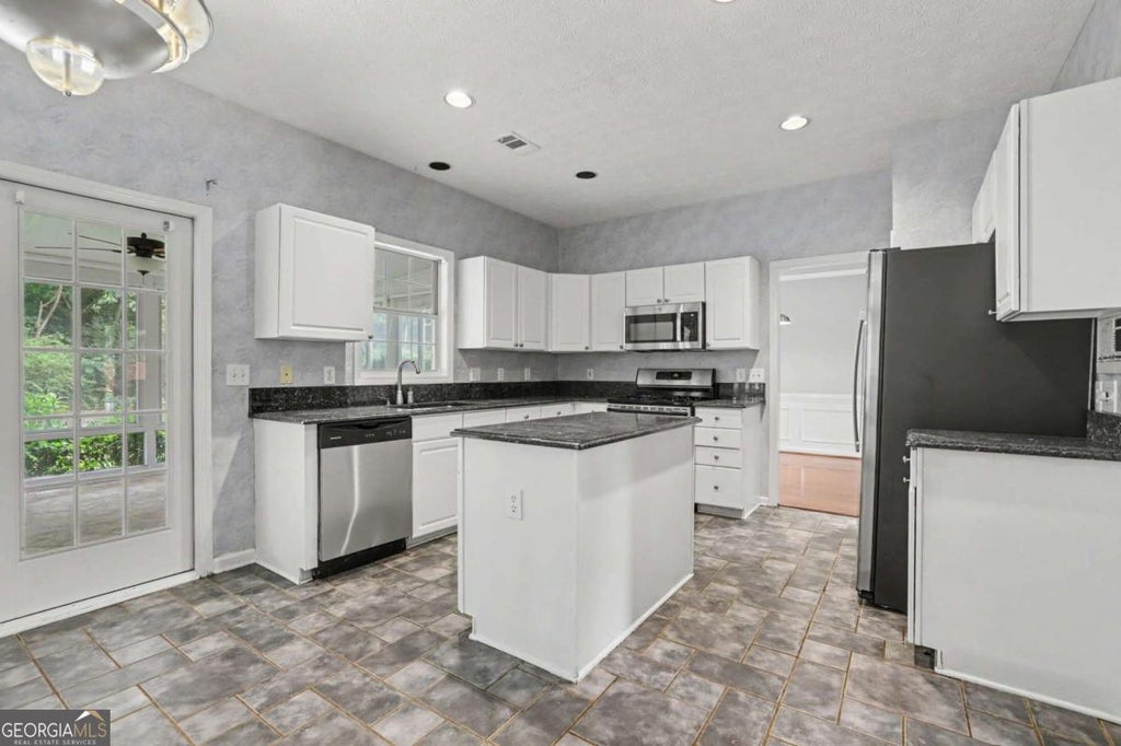 Photo of 525 Cogburn Ridge Way, Alpharetta, GA 30004 (MLS # 10825974)