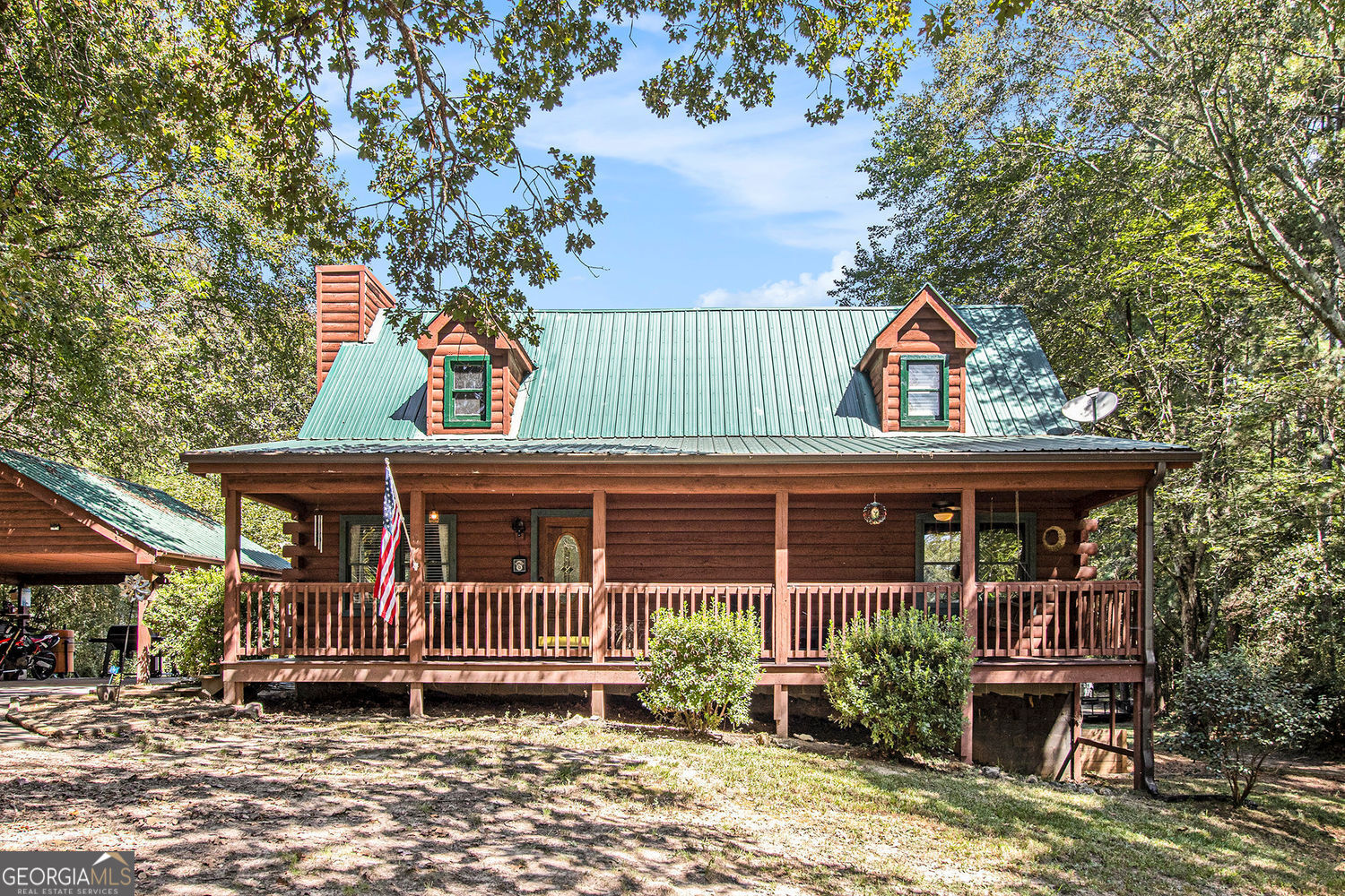 Rustic Charm Meets Modern Comfort on 4 Private Acres. Looking for a retreat that feels worlds away, yet keeps you close to everything you need? Welcome to 4134 Dews Pond Road-a classic log cabin offering timeless character, modern updates, and the ultimate North Georgia lifestyle. Unwind on the spacious rocking chair front porch after a long day and take in the peace and quiet. Step inside to discover an open-concept main floor highlighted by a two-story great room, complete with a wood-paneled cathedral ceiling and a striking stone fireplace with gas logs-perfect for cozy evenings. During the day, natural light streams through the windows, dancing across the oak hardwood floors and filling the space with warmth. The updated kitchen boasts all-new appliances, while thoughtful upgrades throughout-like a new fireplace insert, larger water heater, and modern light fixtures and fans-make this home truly move-in ready. The main floor offers two bedrooms that share a hall bath, while the oversized Owner's Suite upstairs features a private bath and plenty of space to unwind. A loft-style flex area overlooking the great room provides endless options: office, playroom, library, or an additional lounge. Downstairs, the partially finished walk-out basement includes a spacious laundry room and generous room for a workshop, hobby space, or man cave. Double doors and a secondary driveway provide easy access-ideal for lawn equipment, projects, or storage. Step outside to the large rear deck, perfect for entertaining, overlooking your own saltwater pool and expansive backyard. With 4 acres of established hardwoods, this property offers both shade and privacy. A long driveway and covered carport provide plenty of parking and room for that camper, boat, or extra vehicles.This home delivers the best of both worlds-rustic charm, modern updates, and a setting you'll never want to leave. 4134 Dews Pond Road isn't just a home-it's a lifestyle. What are you waiting for? Schedule your private showing today!